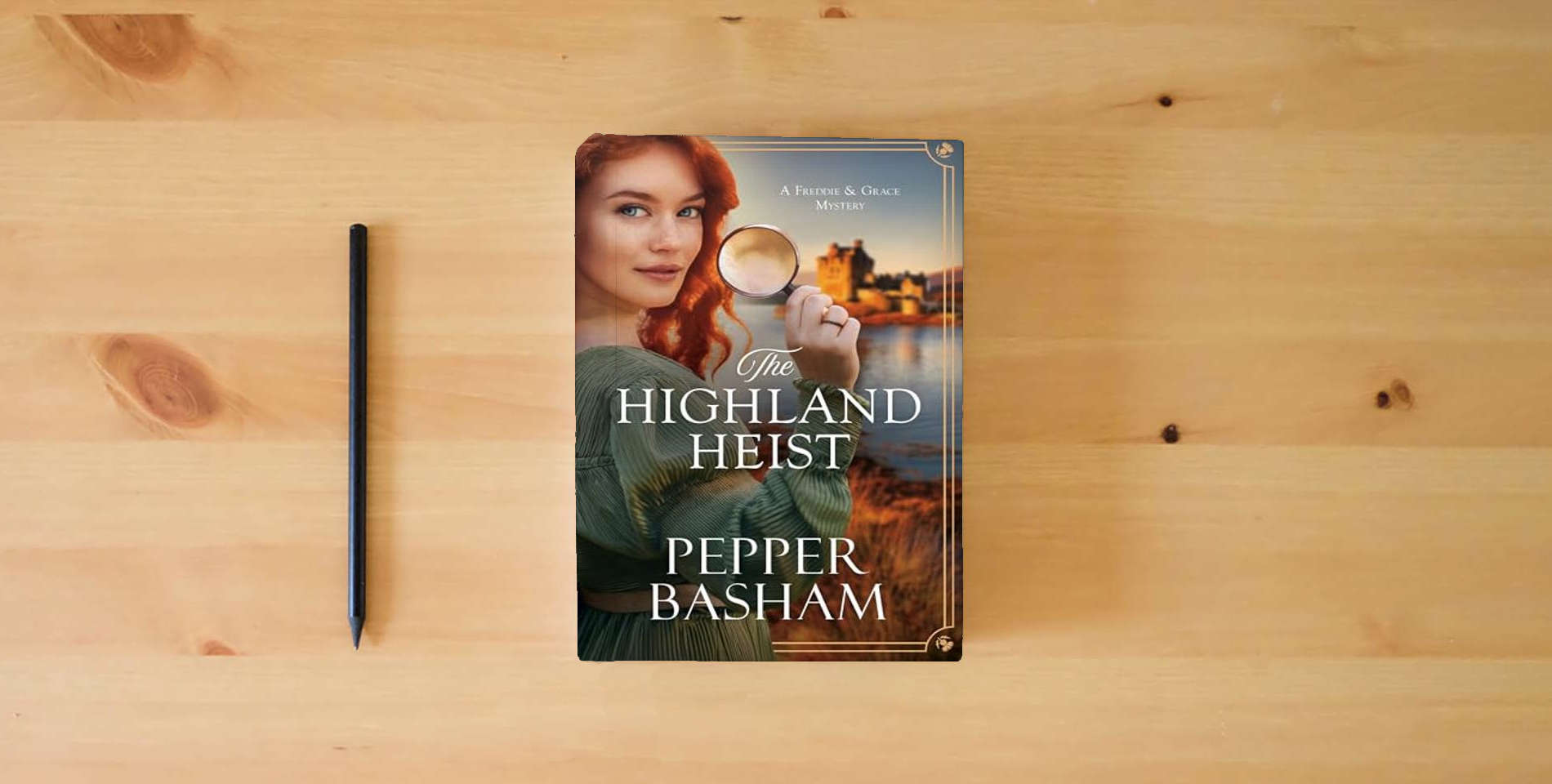 The book The Highland Heist: Volume 4 (A Freddie and Grace Mystery) is on the table