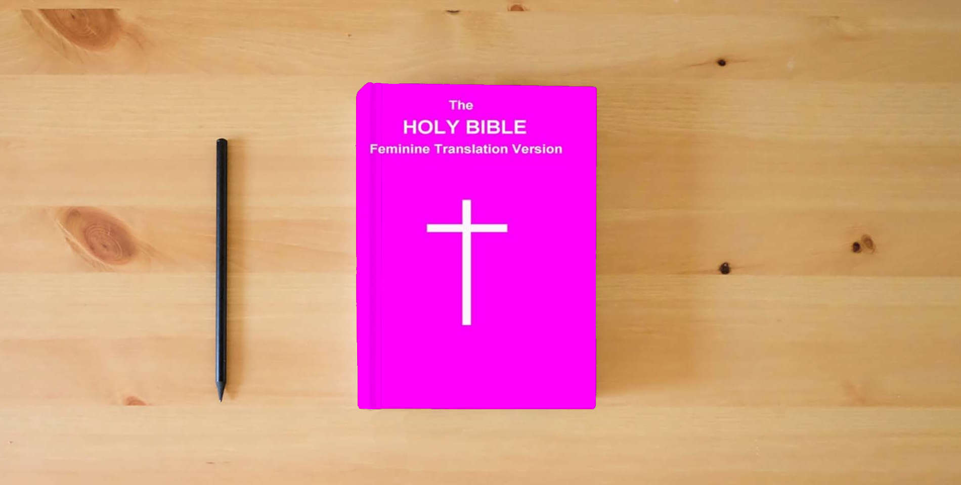The book The HOLY BIBLE Feminine Translation Version is on the table