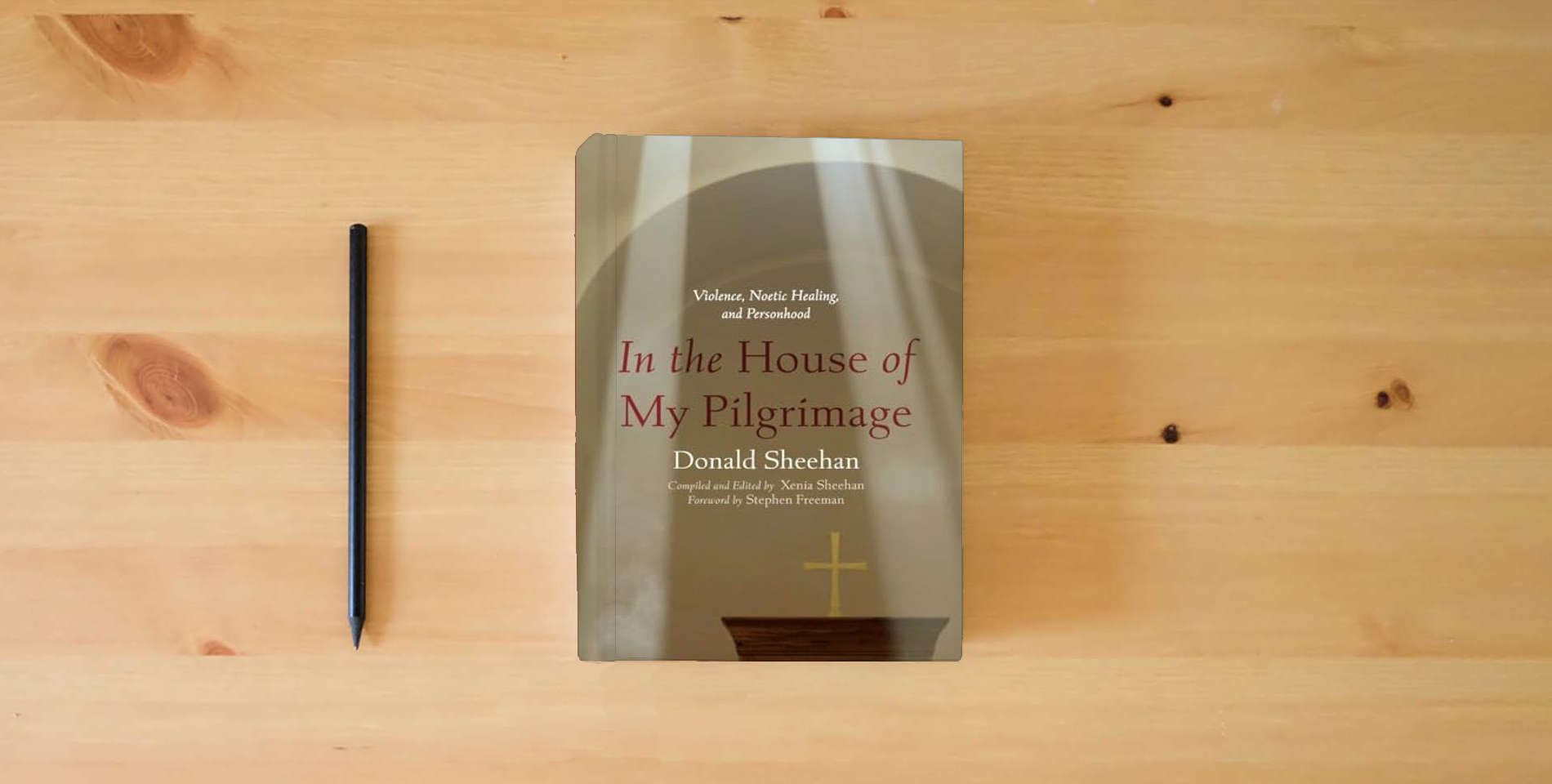 The book In the House of My Pilgrimage: Violence, Noetic Healing, and Personhood is on the table