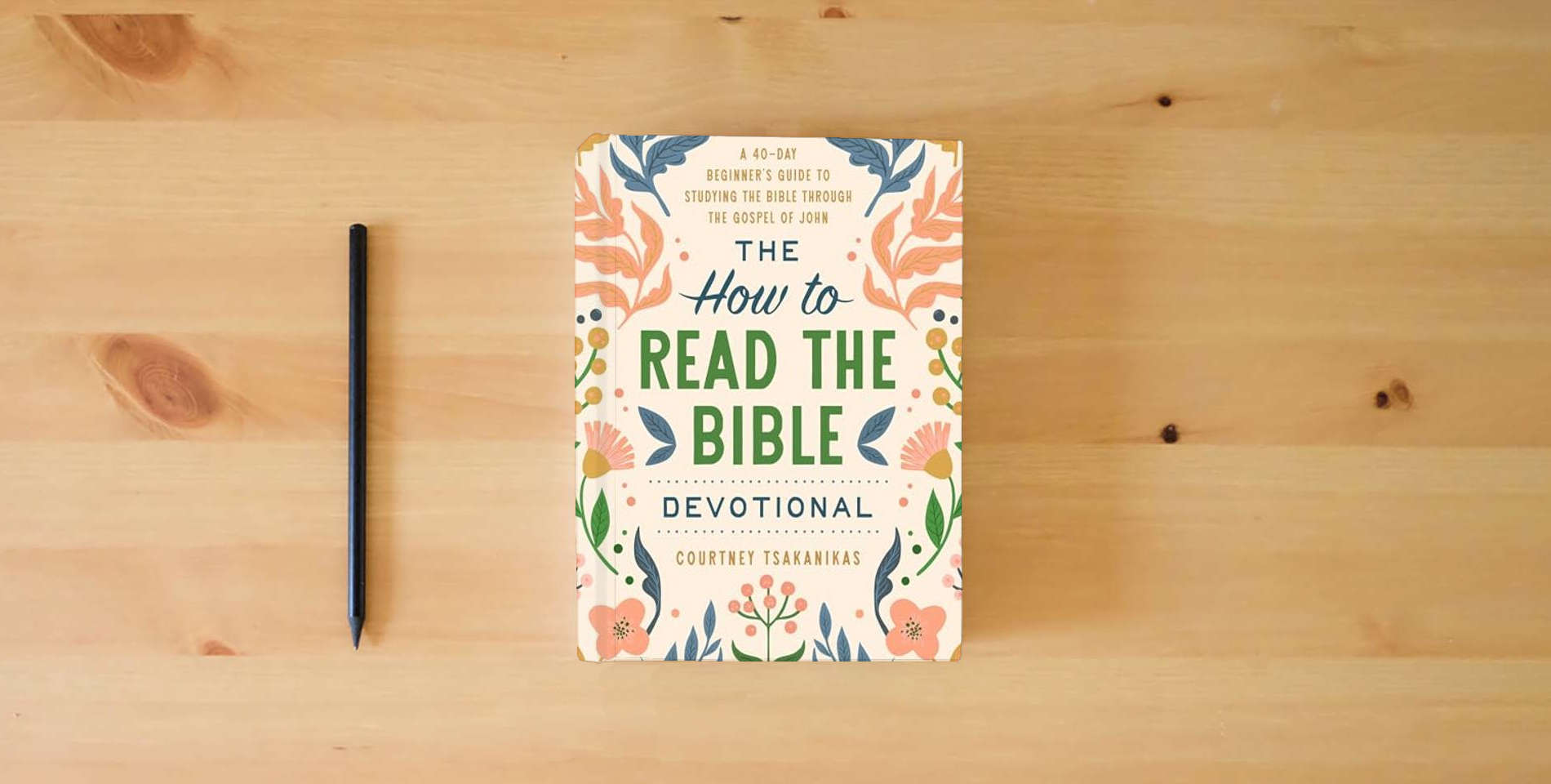 The book The How to Read the Bible Devotional: A 40-Day Beginner's Guide to Studying the Bible through the Gospel of John: Devotional Bible Study Guide for Beginners is on the table