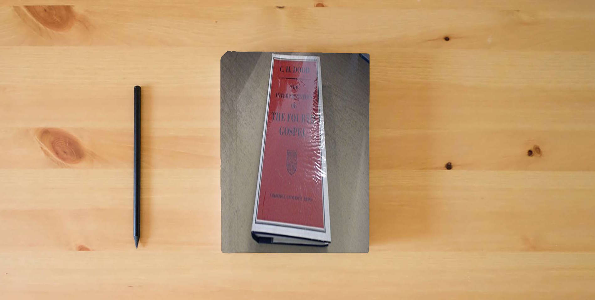 The book The Interpretation of the Fourth Gospel is on the table