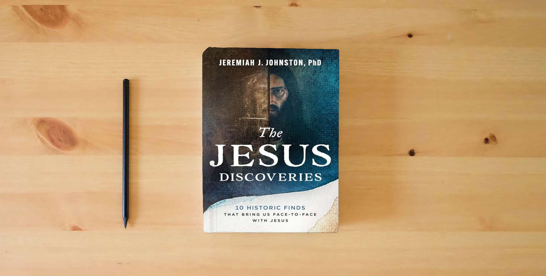 The book The Jesus Discoveries: 10 Historic Finds That Bring Us Face-to-Face with Jesus is on the table