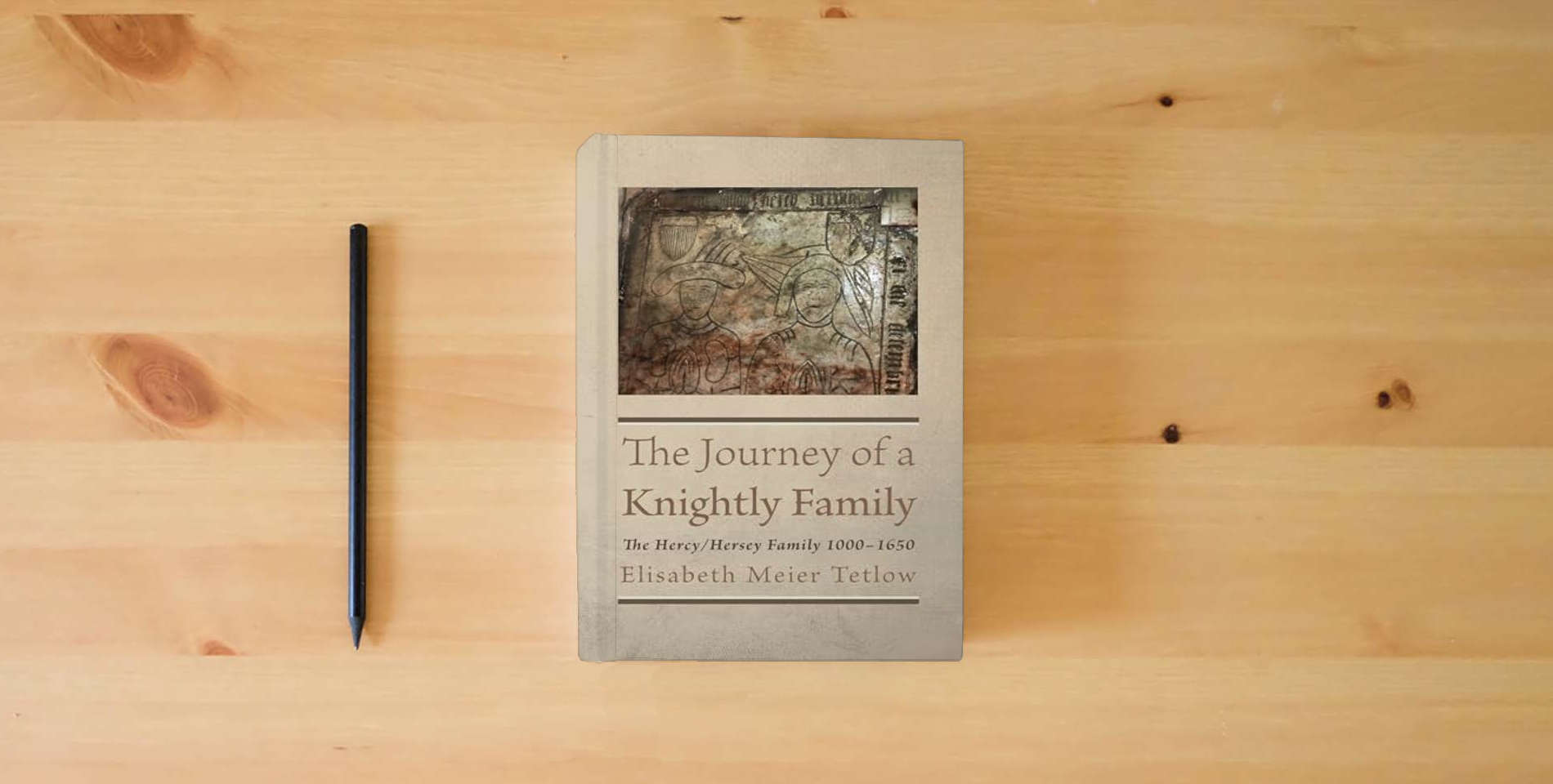 The book The Journey of a Knightly Family: The Hercy/Hersey Family 1000-1650 is on the table