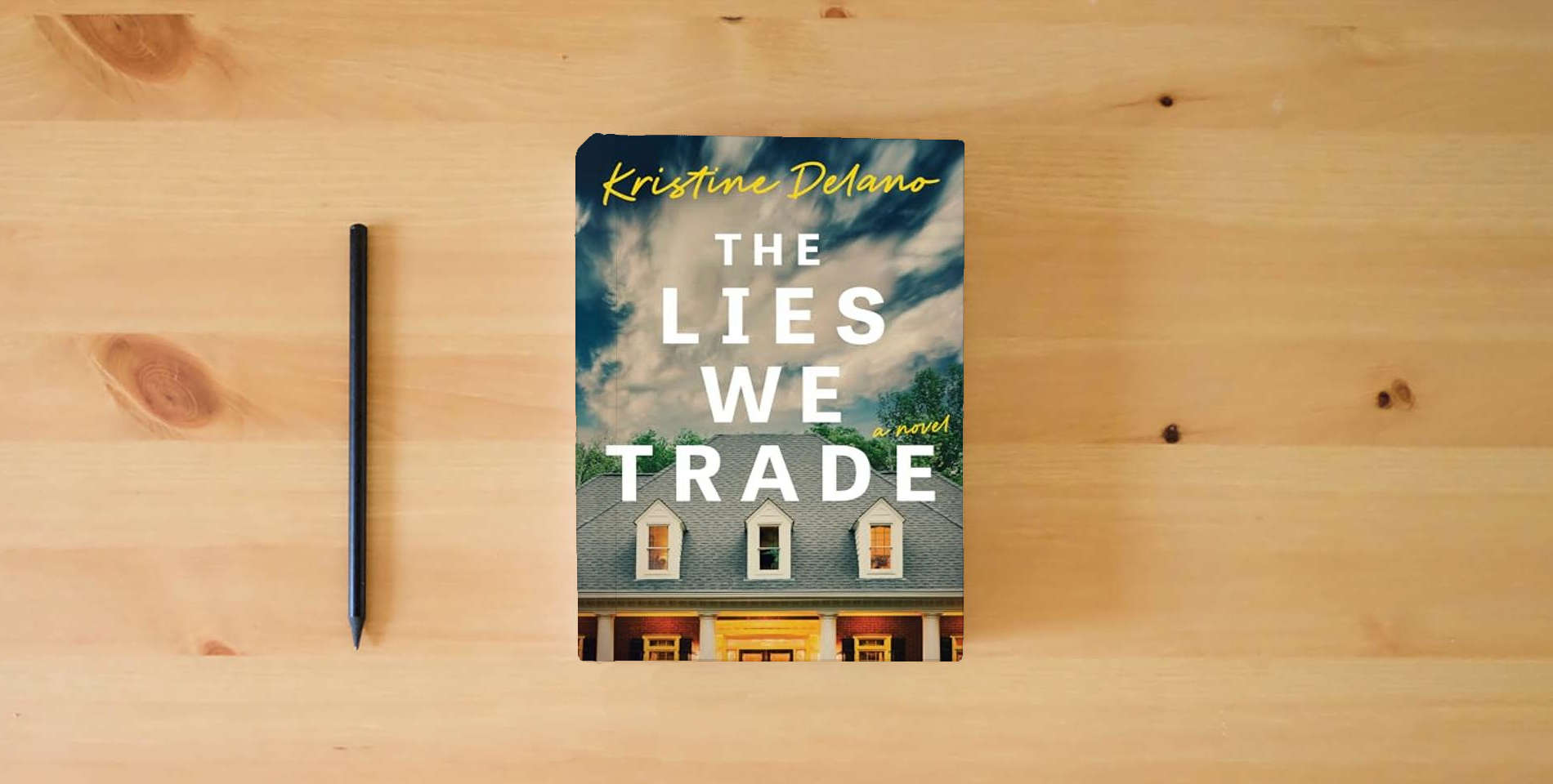 The book The Lies We Trade is on the table