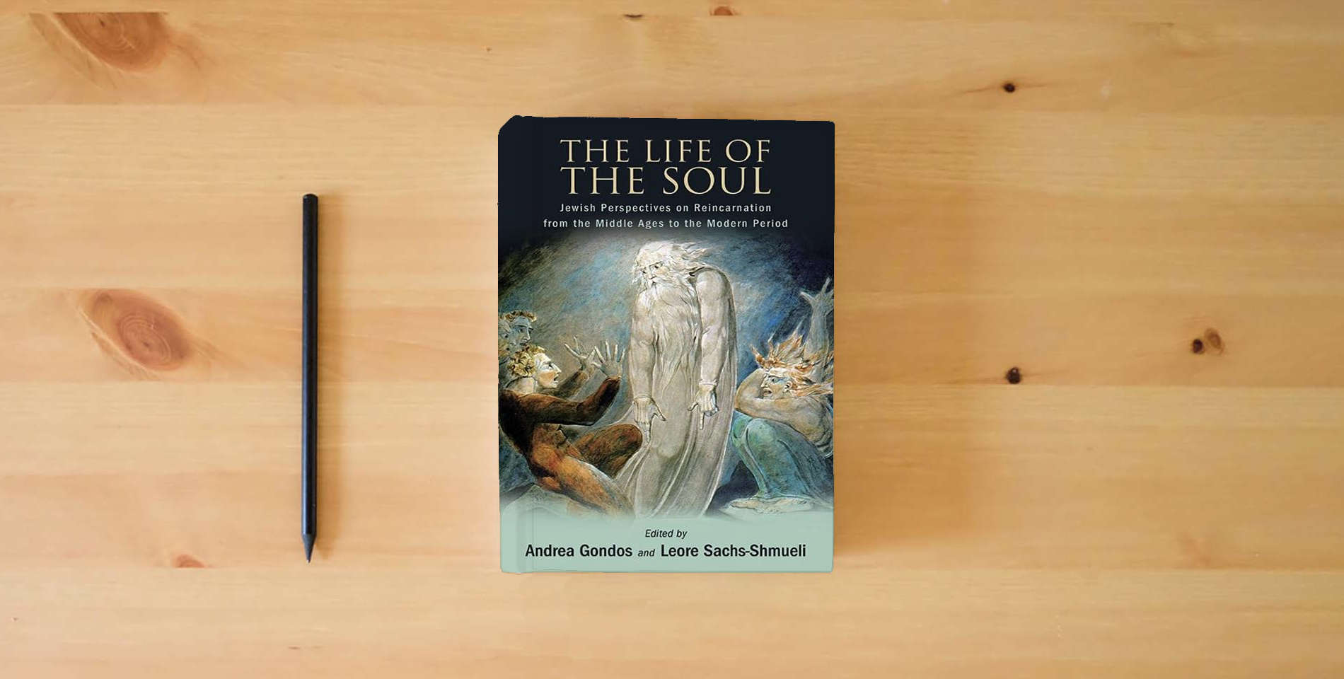 The book The Life of the Soul: Jewish Perspectives on Reincarnation from the Middle Ages to the Modern Period is on the table