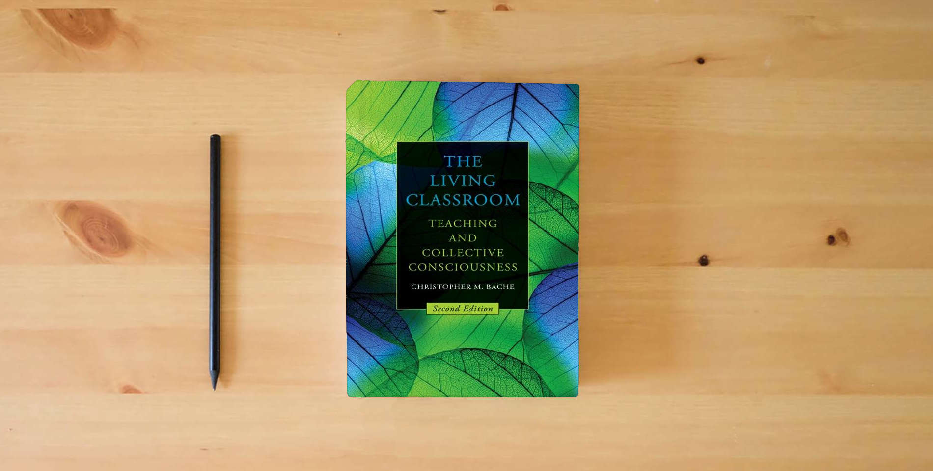 The book The Living Classroom, Second Edition: Teaching and Collective Consciousness is on the table