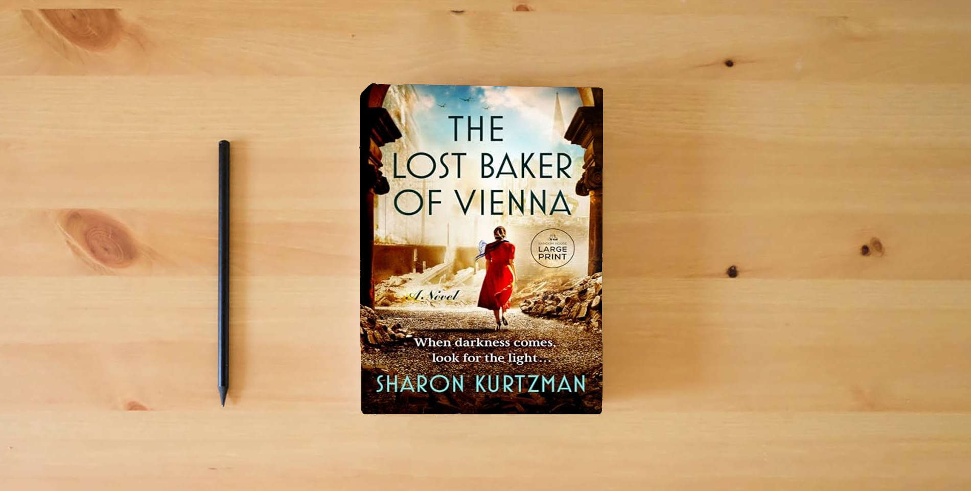 The book The Lost Baker of Vienna: A Novel is on the table