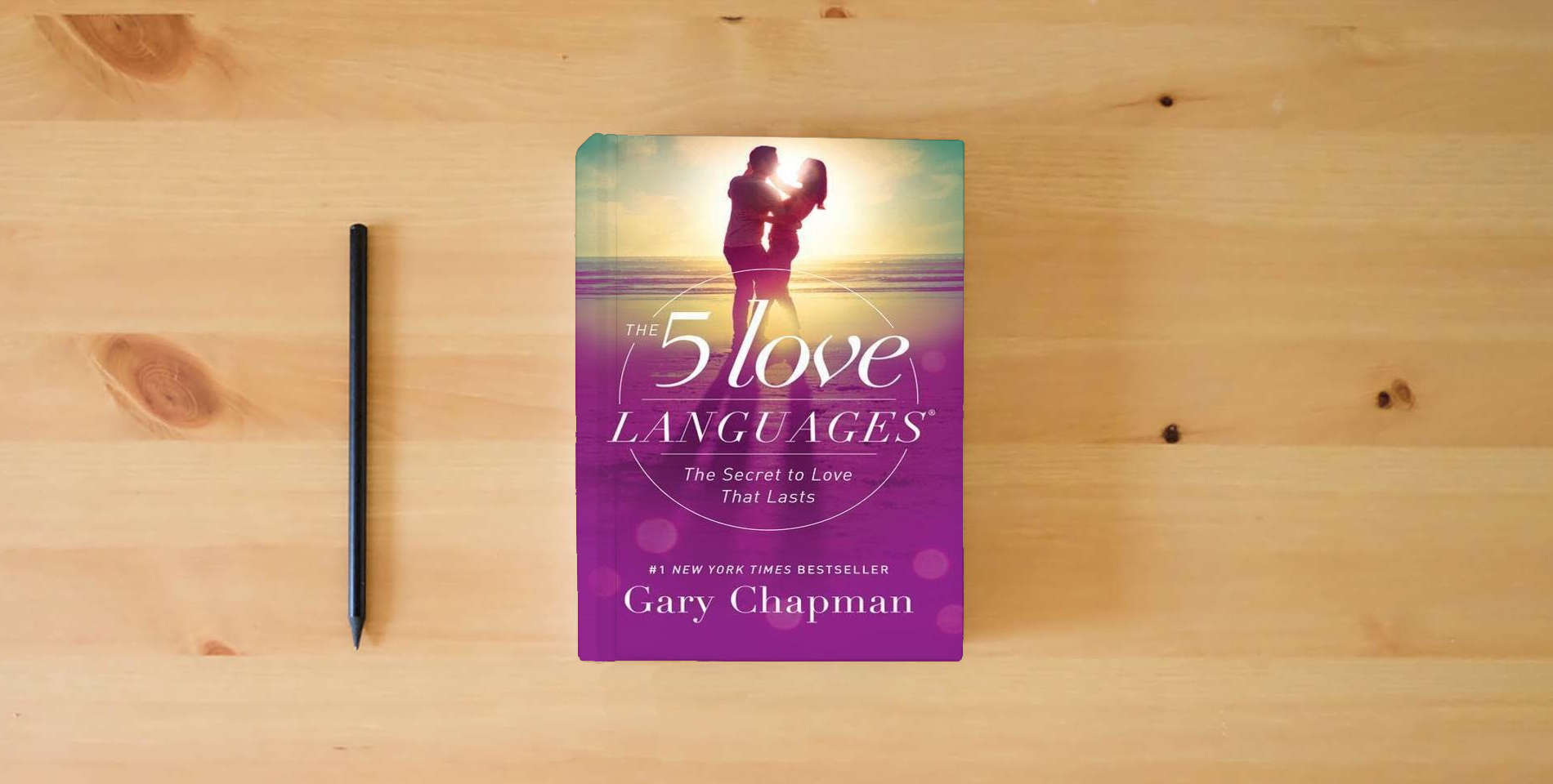 The book The 5 Love Languages: The Secret to Love that Lasts is on the table