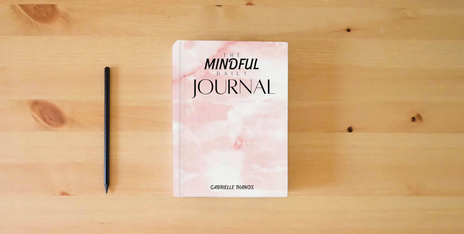The book The Mindful Daily Journal is on the table