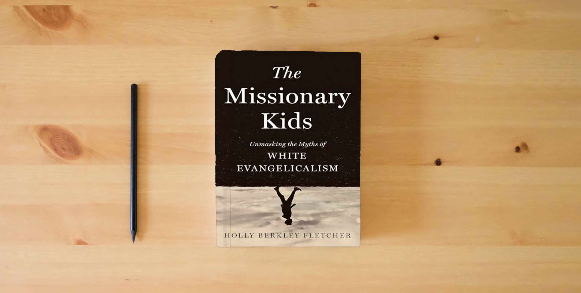 The book The Missionary Kids: Unmasking the Myths of White Evangelicalism is on the table
