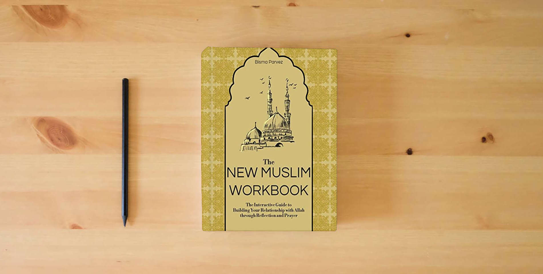 The book The New Muslim Workbook: The Interactive Guide to Building Your Relationship with Allah through Reflection and Prayer is on the table