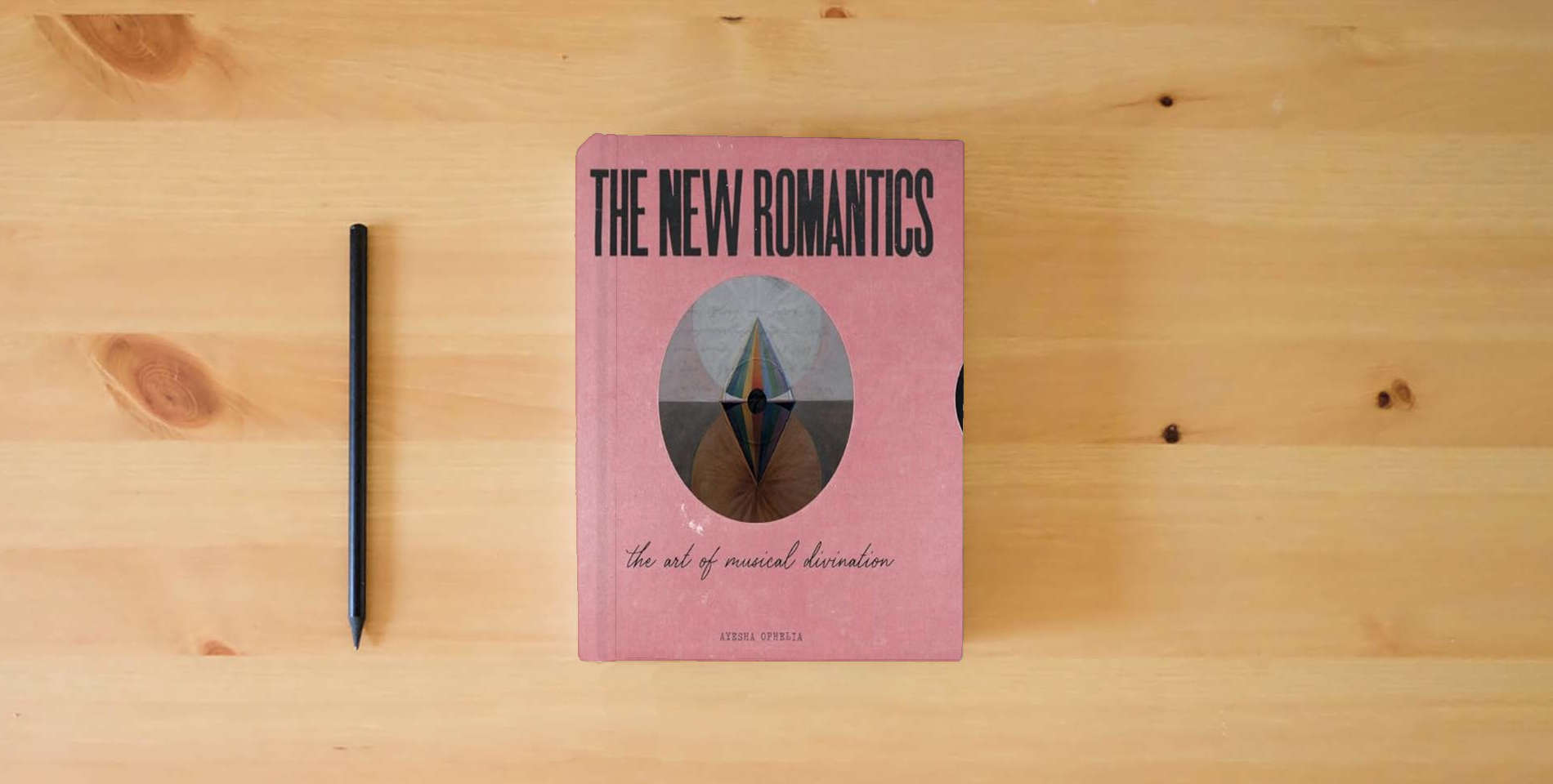 The book The New Romantics: The Art Of Musical Divination is on the table