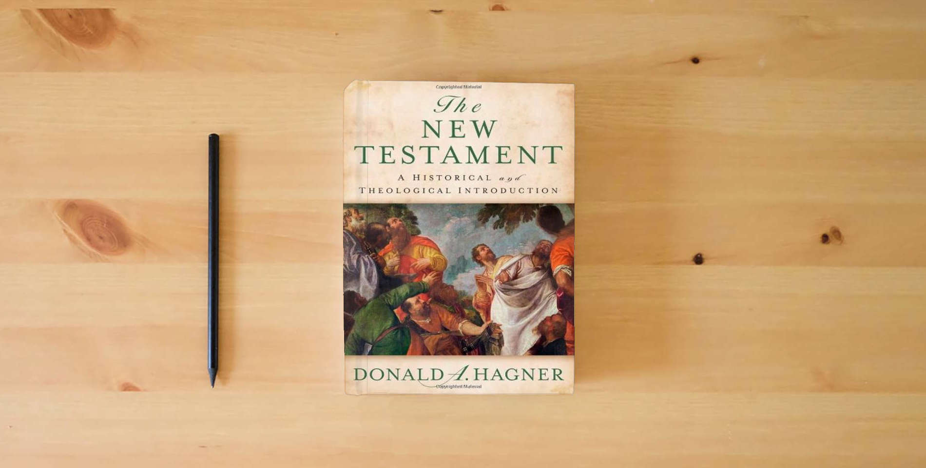 The book The New Testament: A Historical and Theological Introduction is on the table