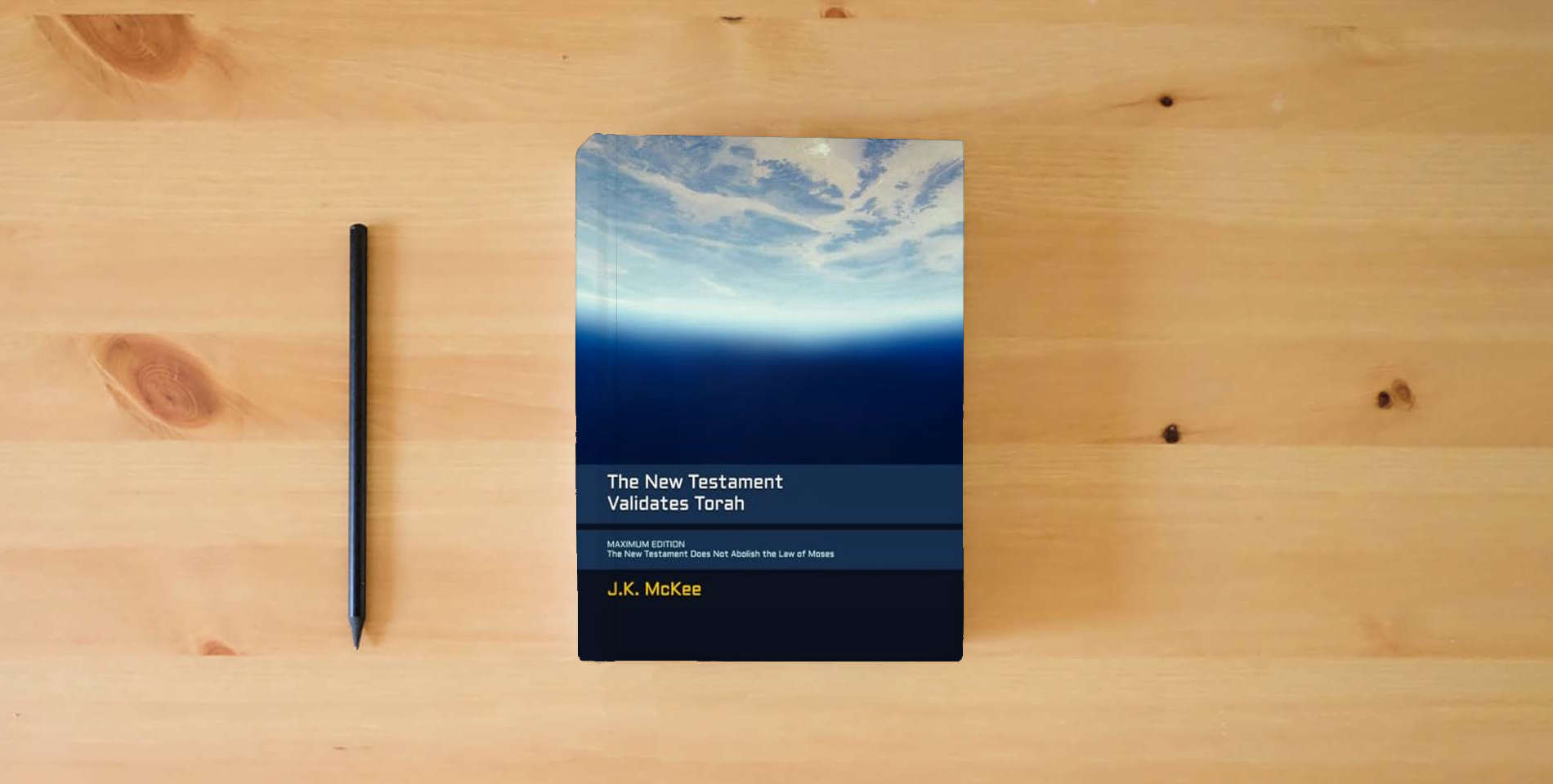 The book The New Testament Validates Torah MAXIMUM EDITION: The New Testament Does Not Abolish the Law of Moses is on the table