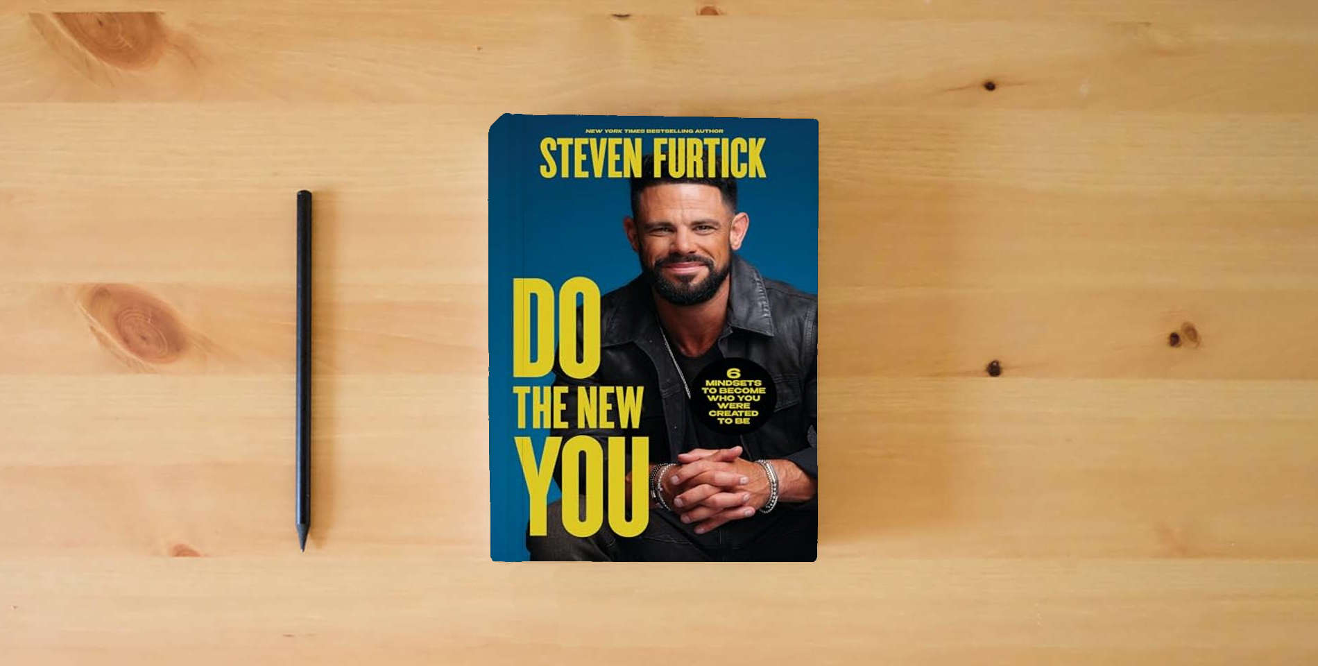 The book Do the New You: 6 Mindsets to Become Who You Were Created to Be is on the table