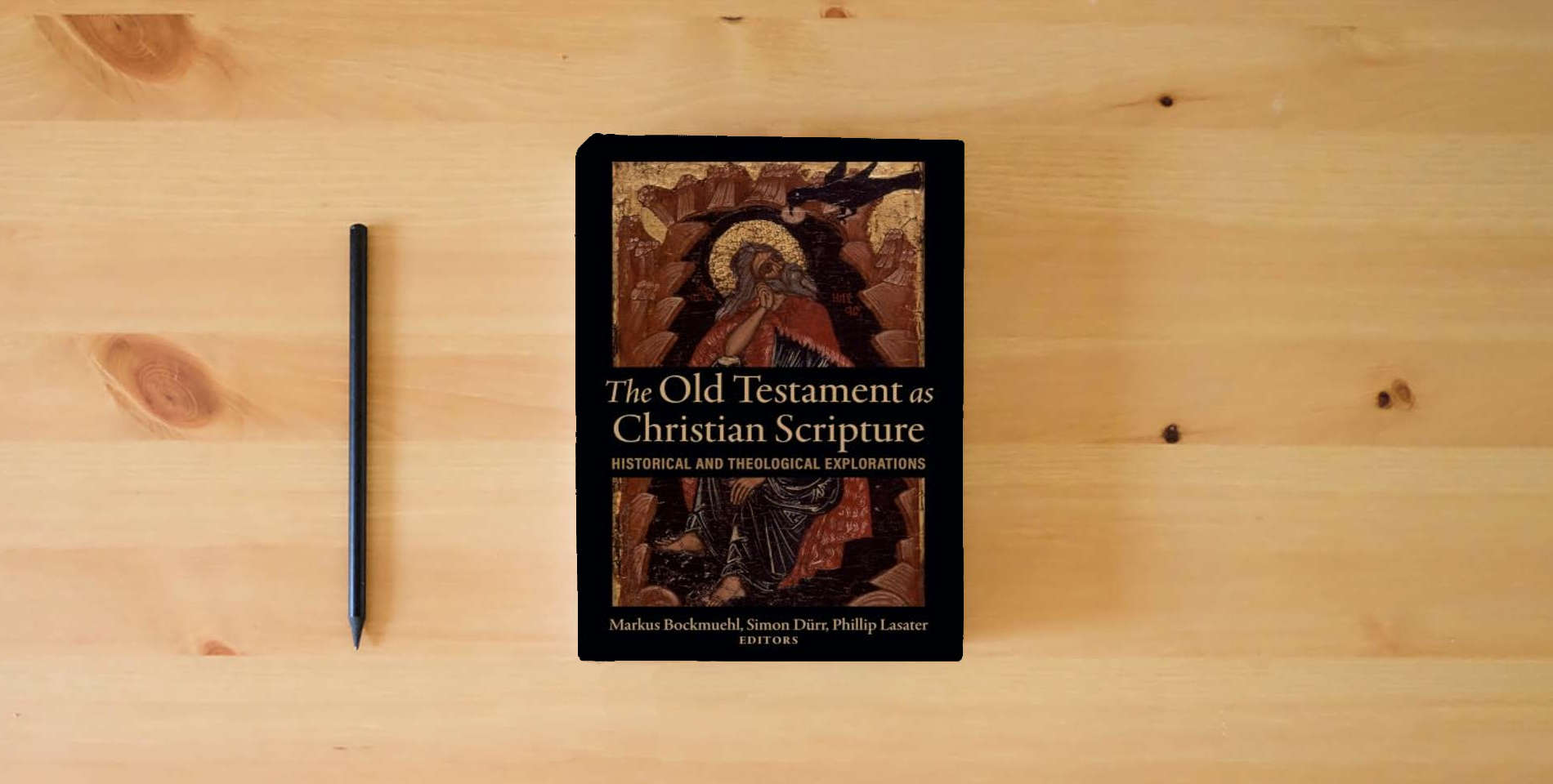 The book The Old Testament as Christian Scripture: Historical and Theological Explorations is on the table