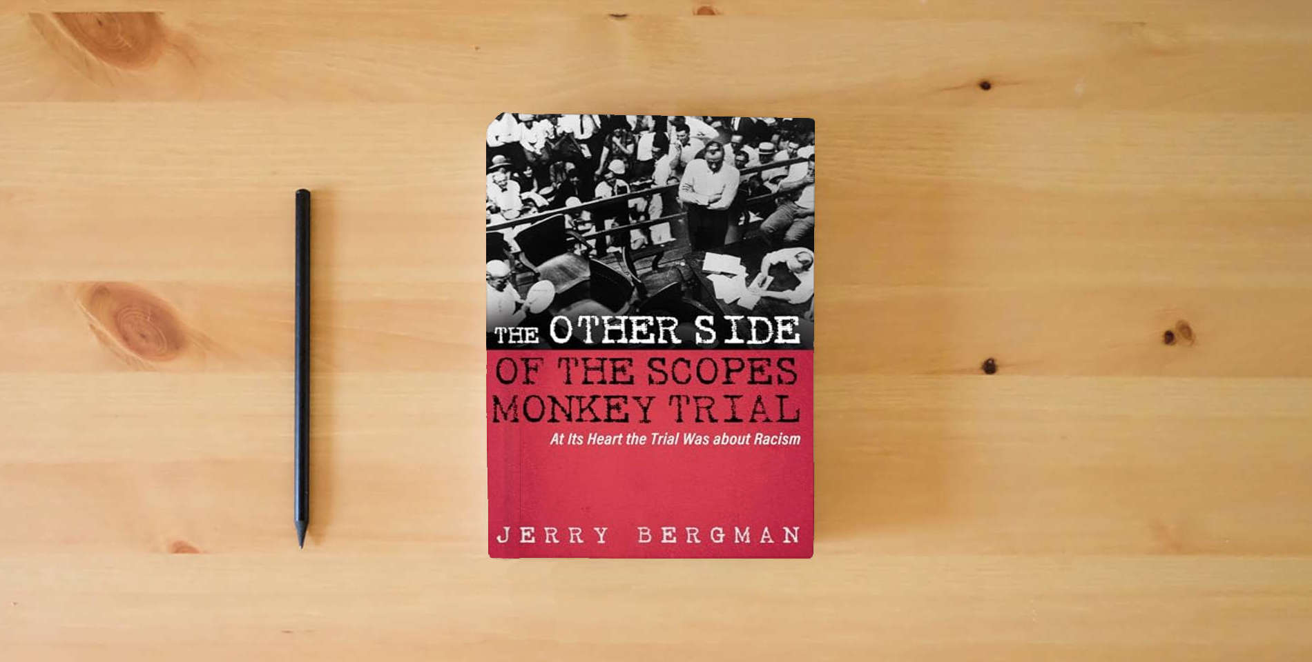 The book The Other Side of the Scopes Monkey Trial: At Its Heart the Trial Was about Racism is on the table