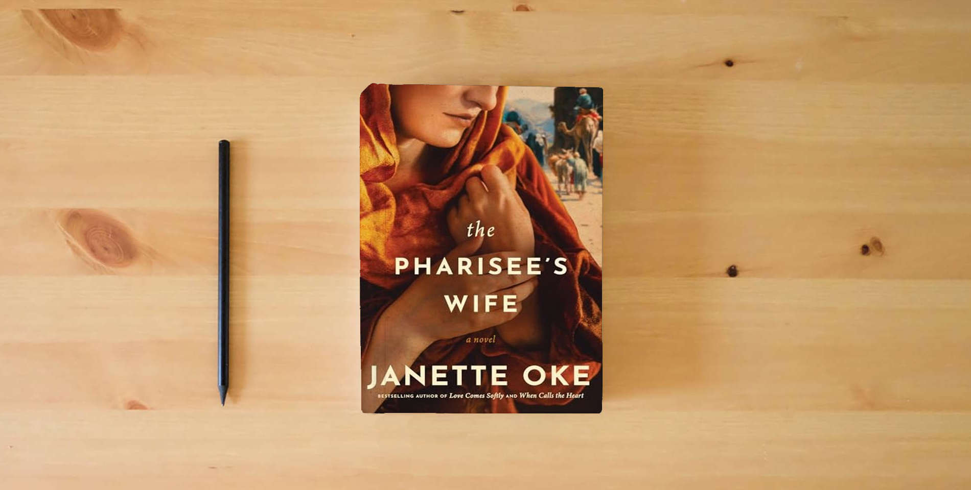 The book The Pharisee's Wife is on the table