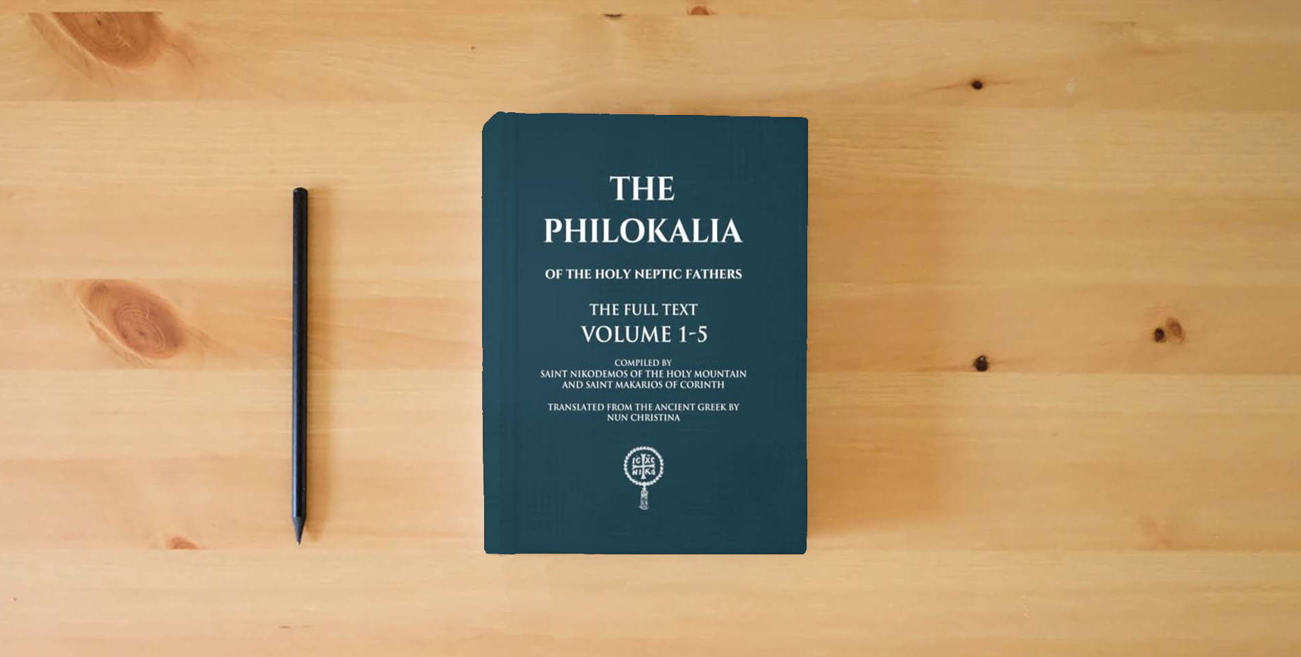 The book The Philokalia Volumes 1 - 5 The FULL Text is on the table
