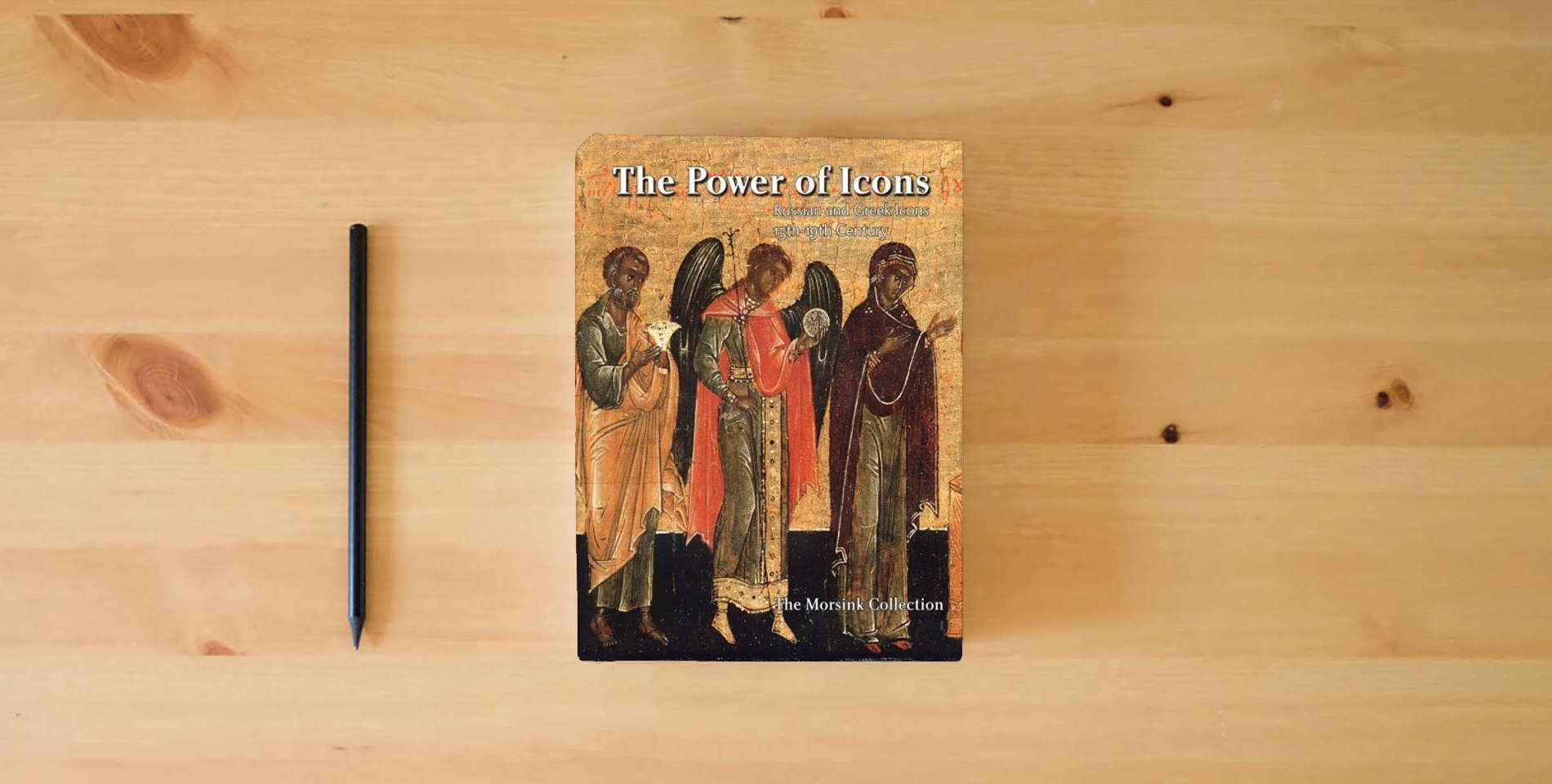 The book The Power of Icons: Russian and Greek Icons 15th-19th Century: Collection Jan Morsink is on the table