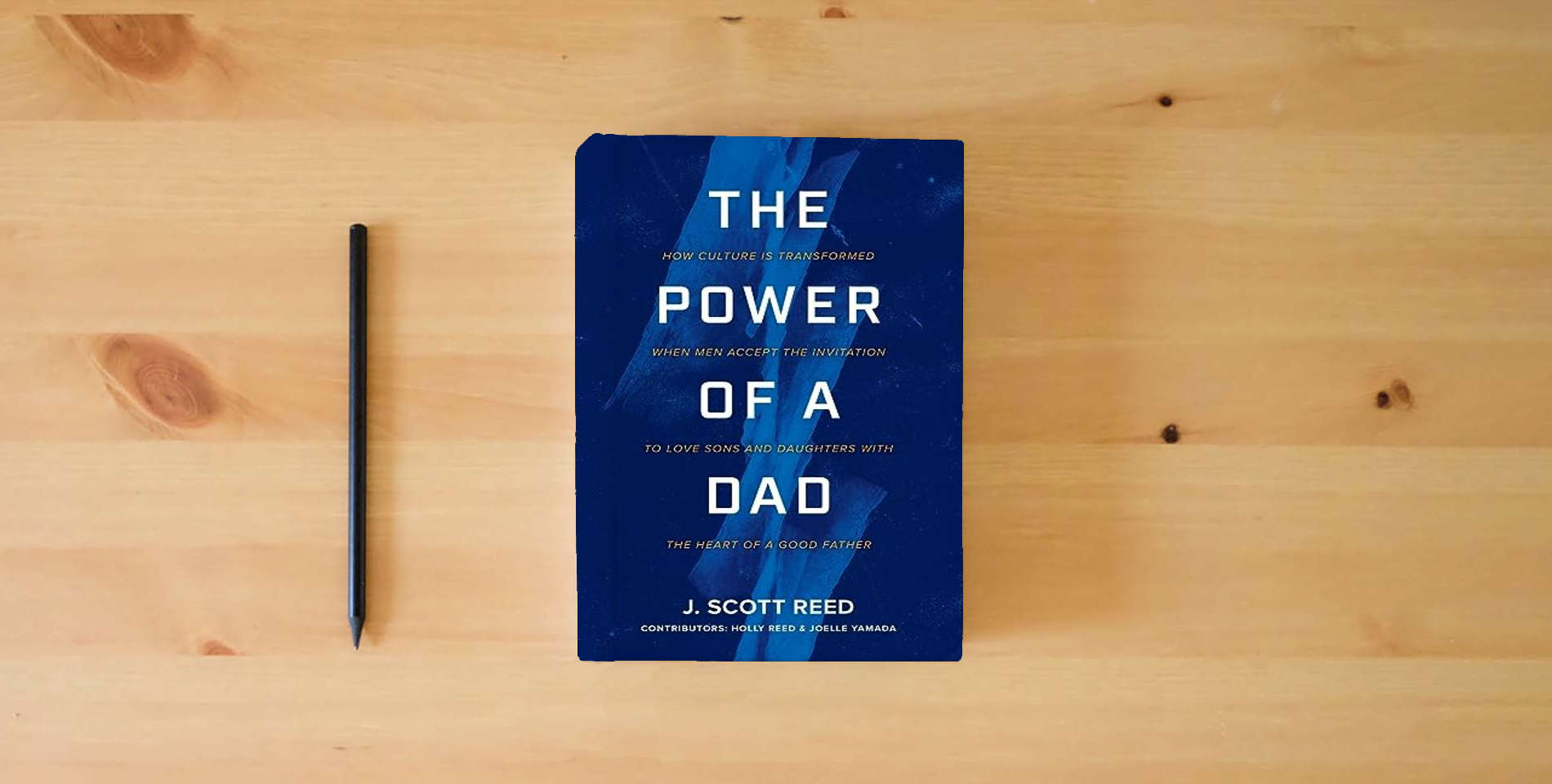 The book The Power of a Dad is on the table