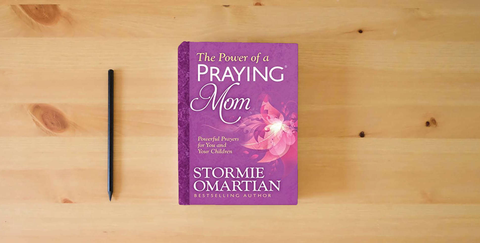 The book The Power of a Praying Mom: Powerful Prayers for You and Your Children is on the table