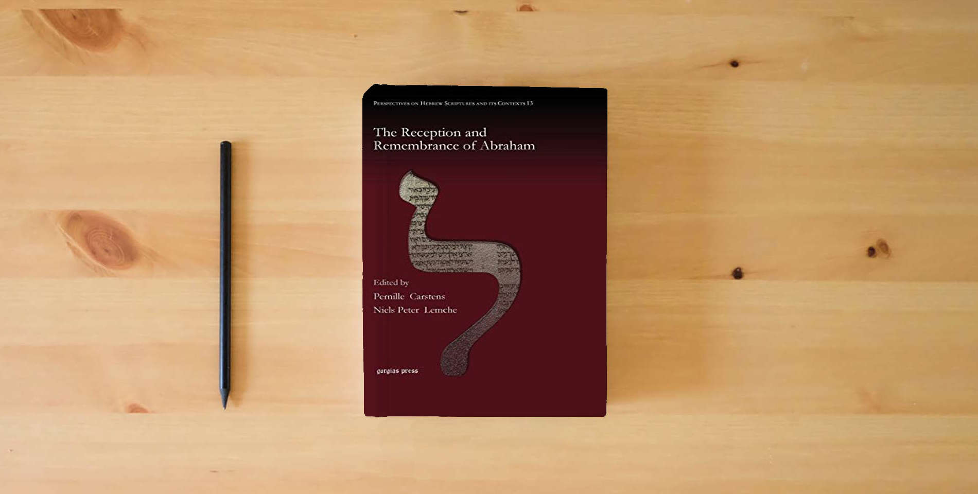 The book The Reception and Remembrance of Abraham (Perspectives on Hebrew Scriptures and Its Contexts) is on the table