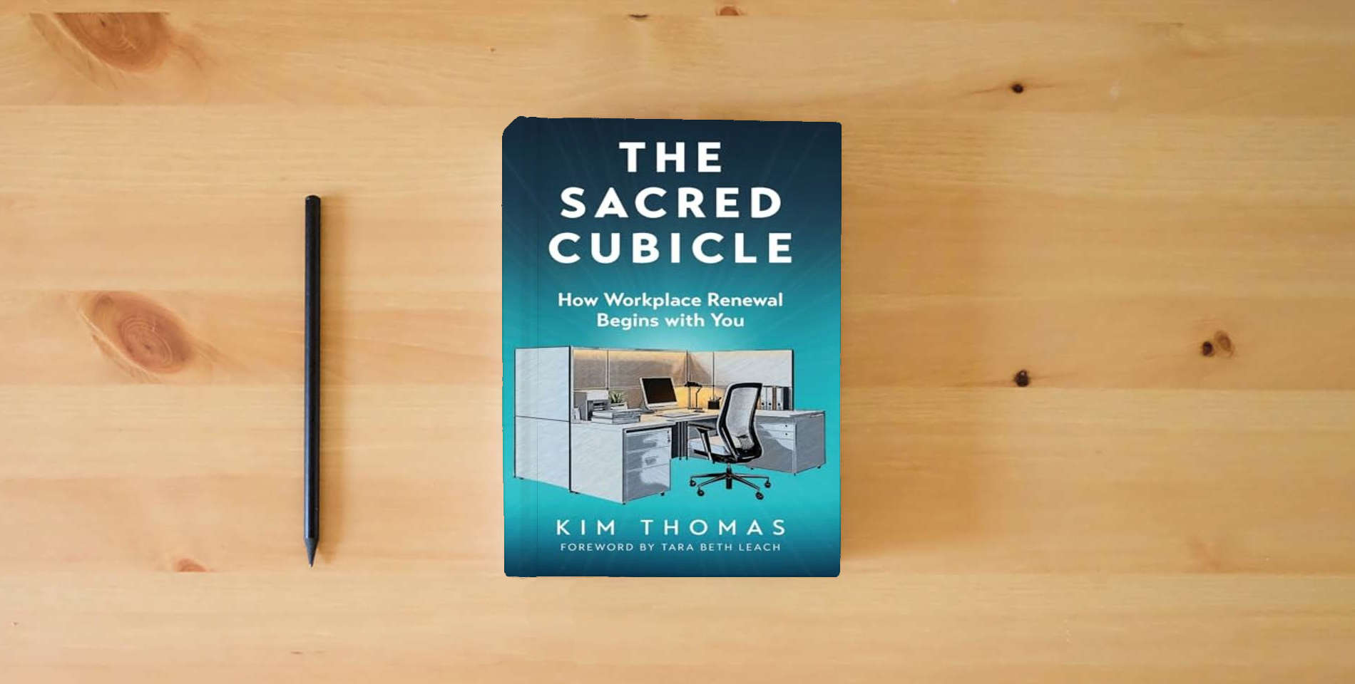 The book The Sacred Cubicle: How Workplace Renewal Begins with You is on the table