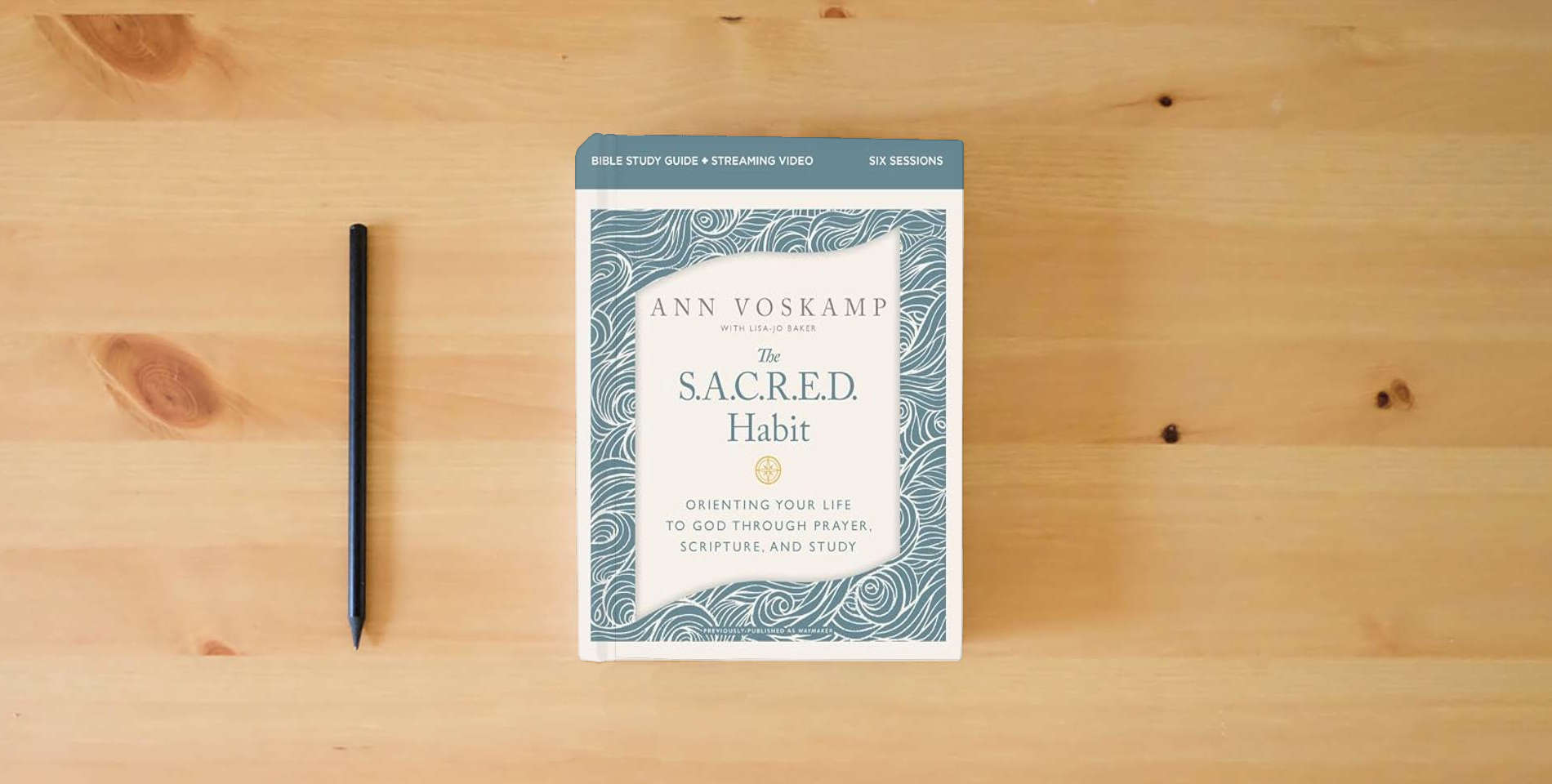The book The SACRED Habit Bible Study Guide plus Streaming Video: Orienting Your Life with God Through Prayer, Scripture, and Study is on the table