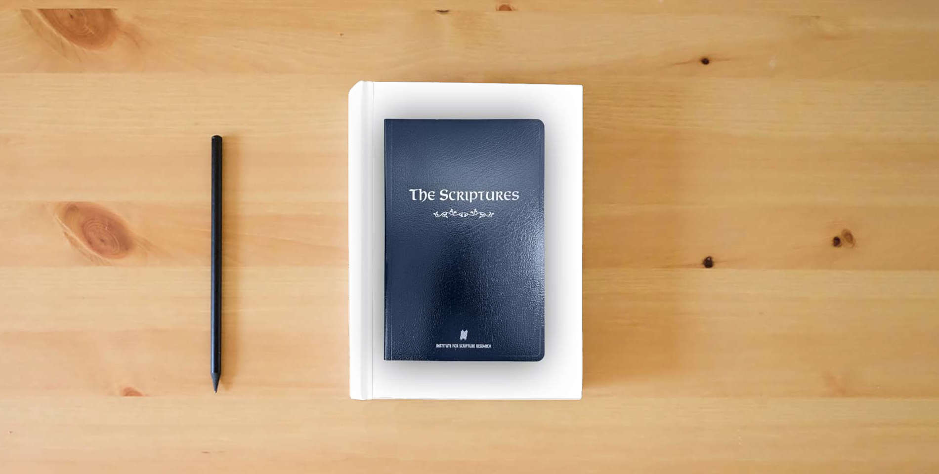 The book The Scriptures is on the table