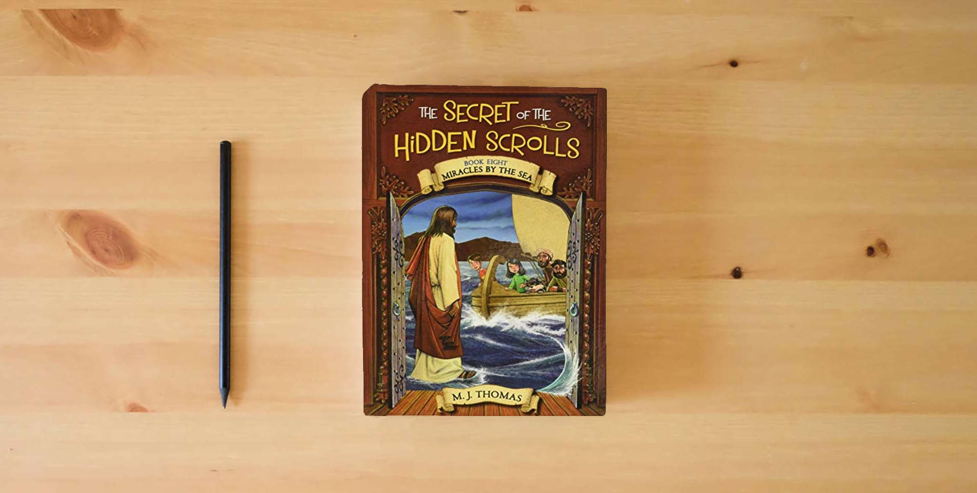 The book The Secret of the Hidden Scrolls: Miracles by the Sea, Book 8 (The Secret of the Hidden Scrolls, 8) is on the table