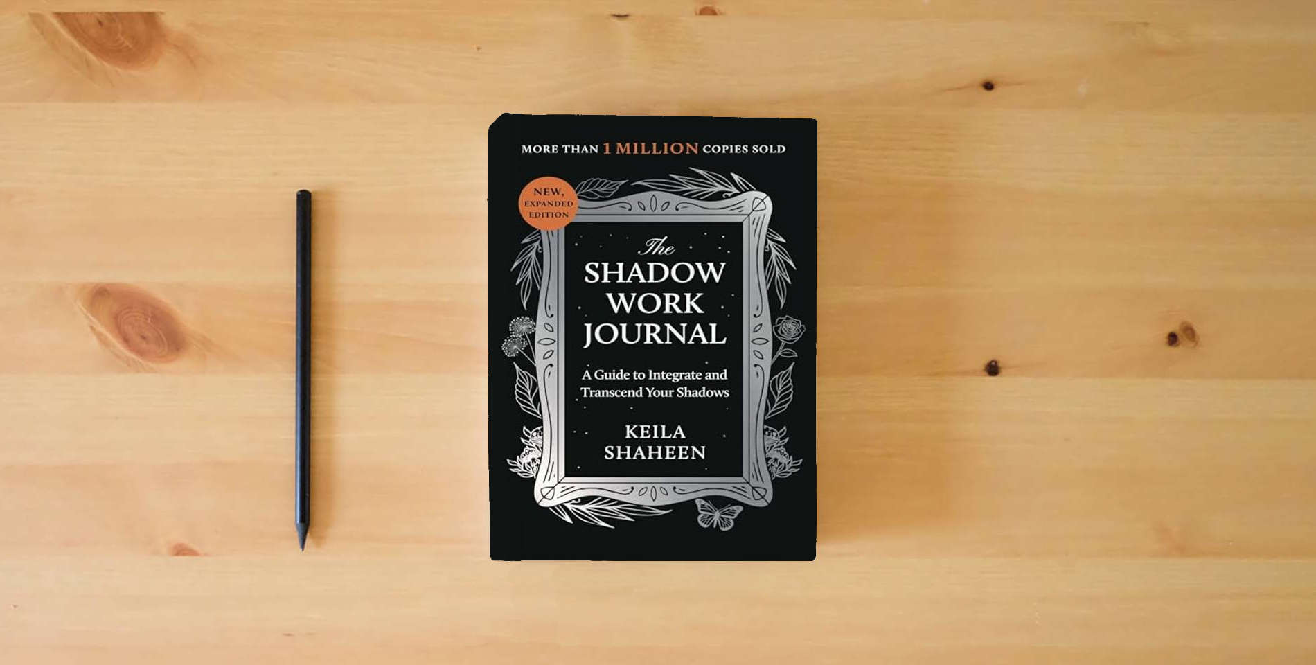 The book The Shadow Work Journal: A Guide to Integrate and Transcend Your Shadows is on the table