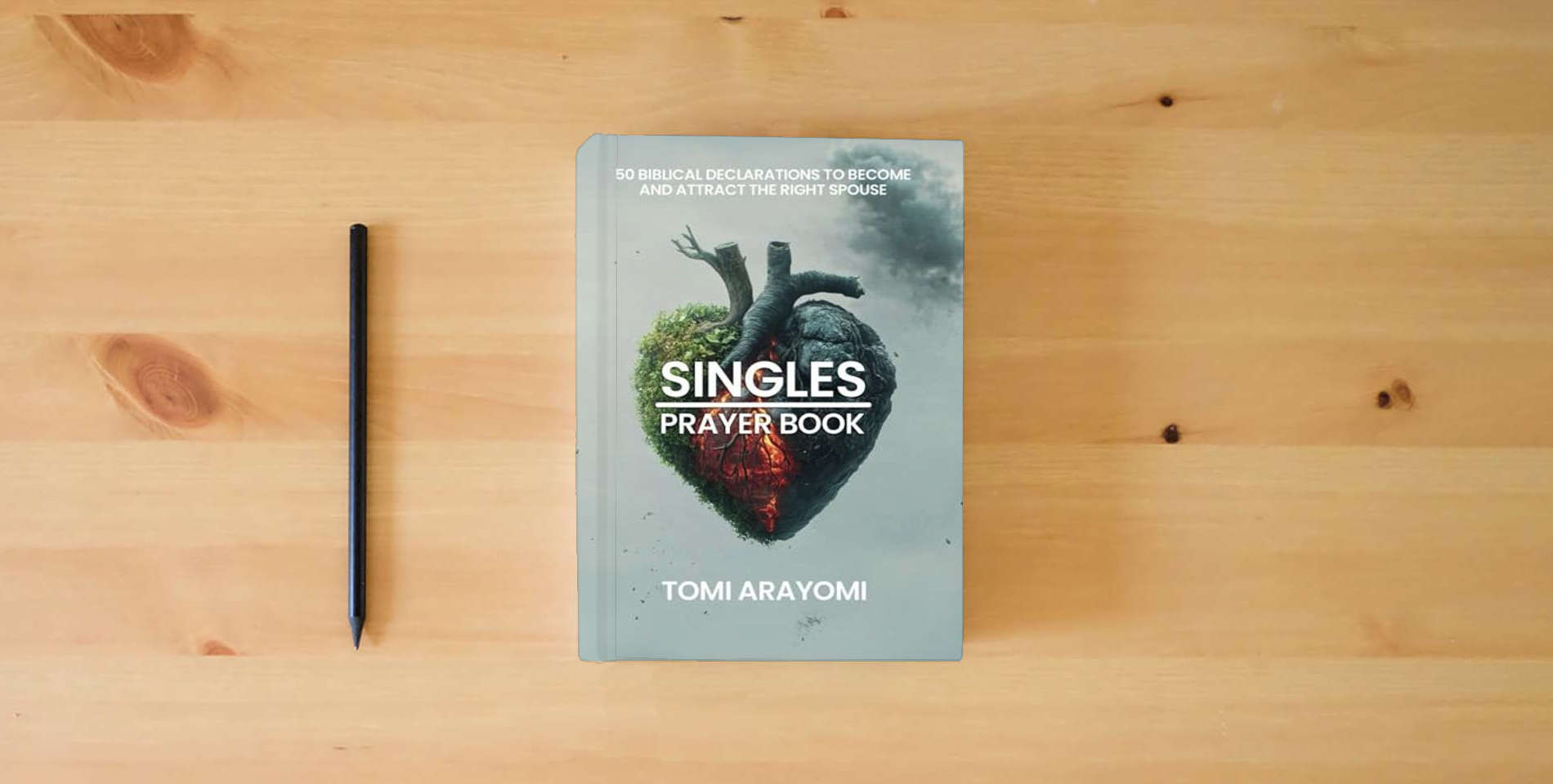 The book The Singles Prayer Book: 50 Biblical Declarations to Become and Attract the Right Spouse (Declarations for Breakthrough) is on the table