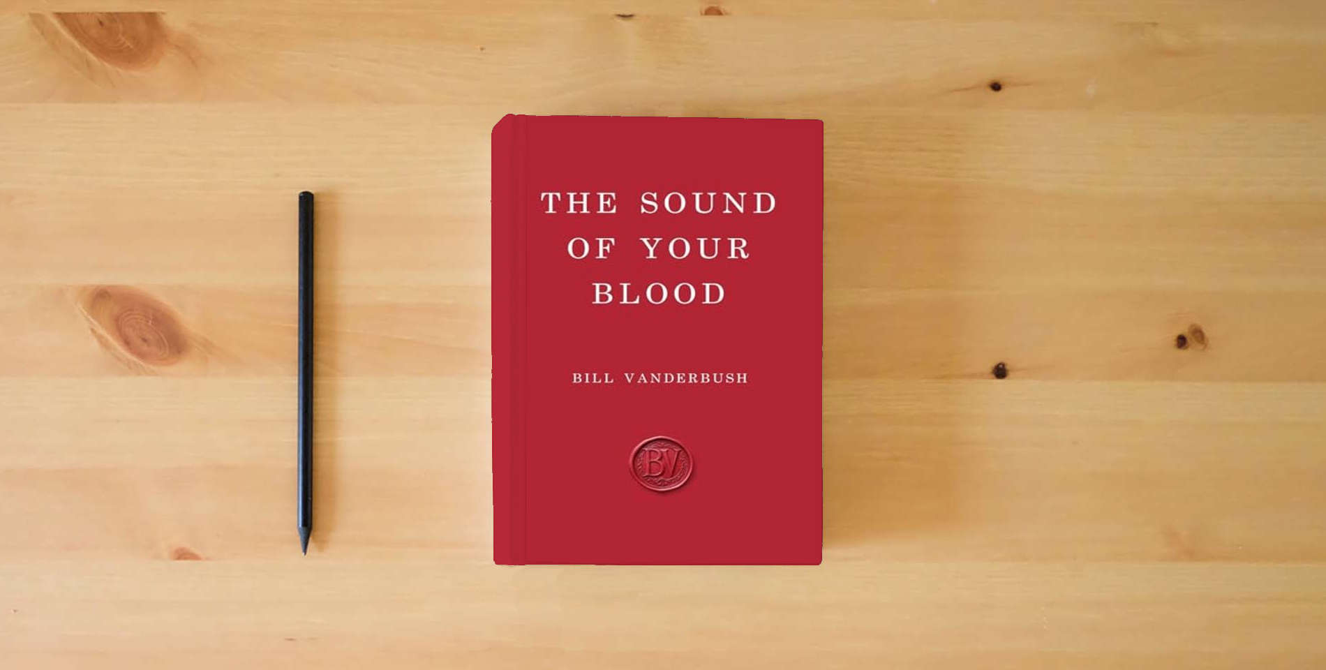 The book The Sound of Your Blood is on the table