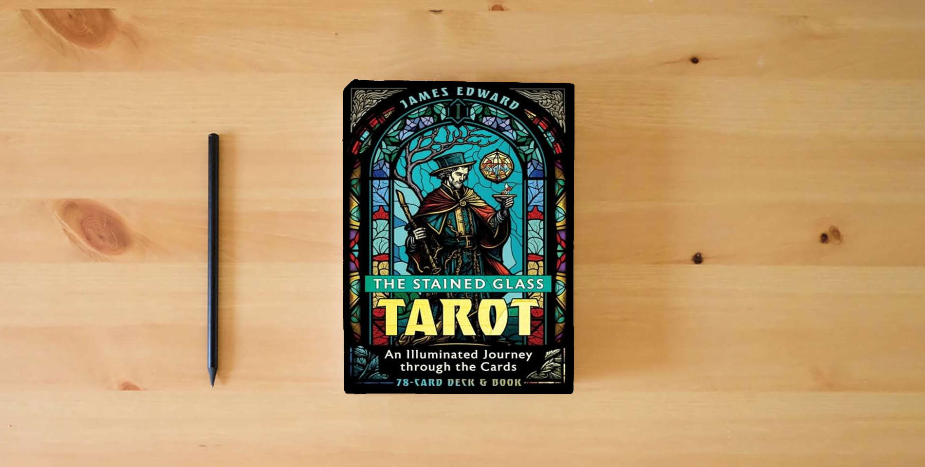 The book The Stained Glass Tarot: An Illuminated Journey through the Cards is on the table