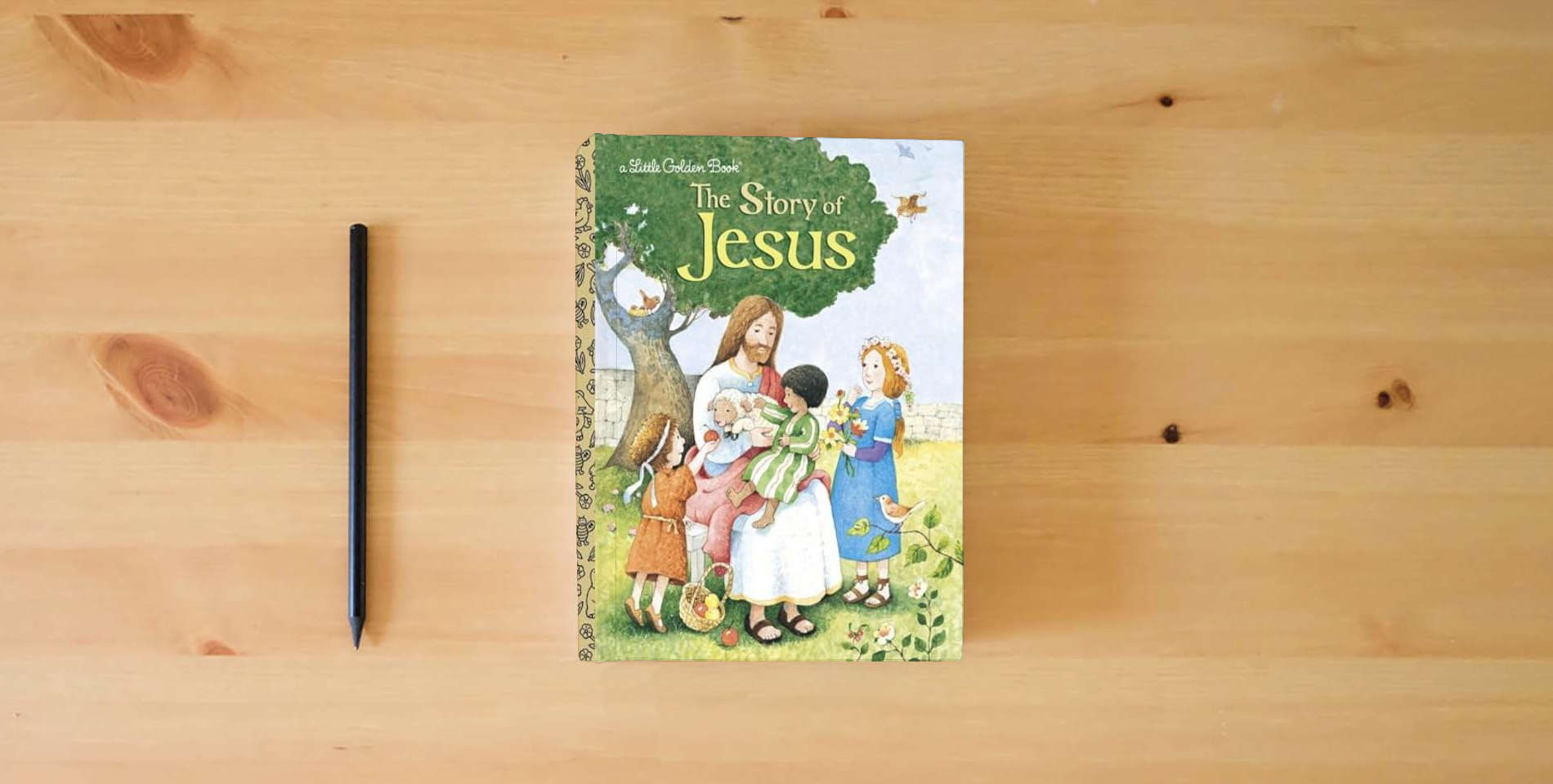 The book The Story of Jesus: A Christian Book for Kids (Little Golden Book) is on the table