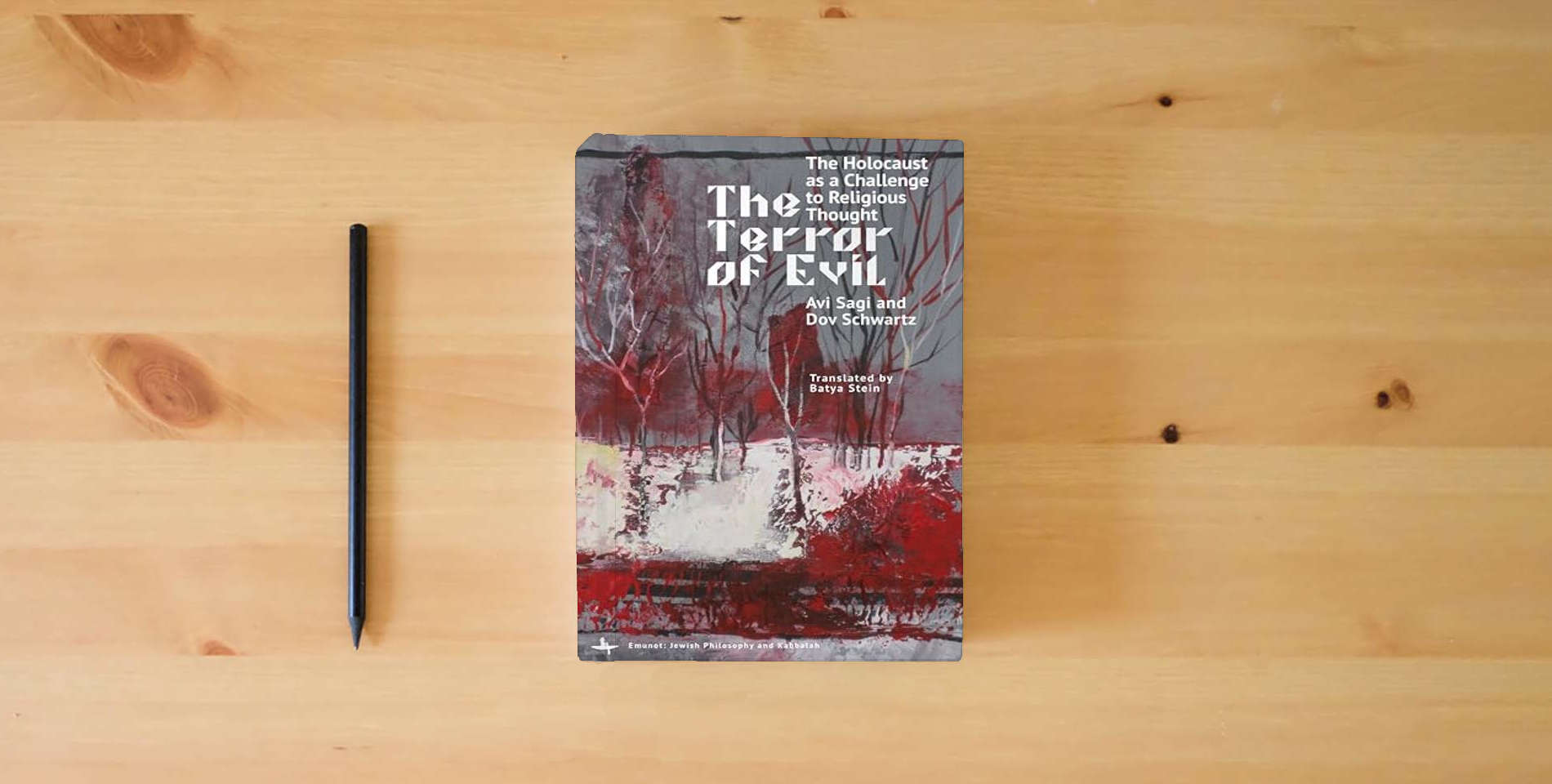 The book The Terror of Evil: The Holocaust as a Challenge to Religious Thought (Emunot: Jewish Philosophy and Kabbalah) is on the table