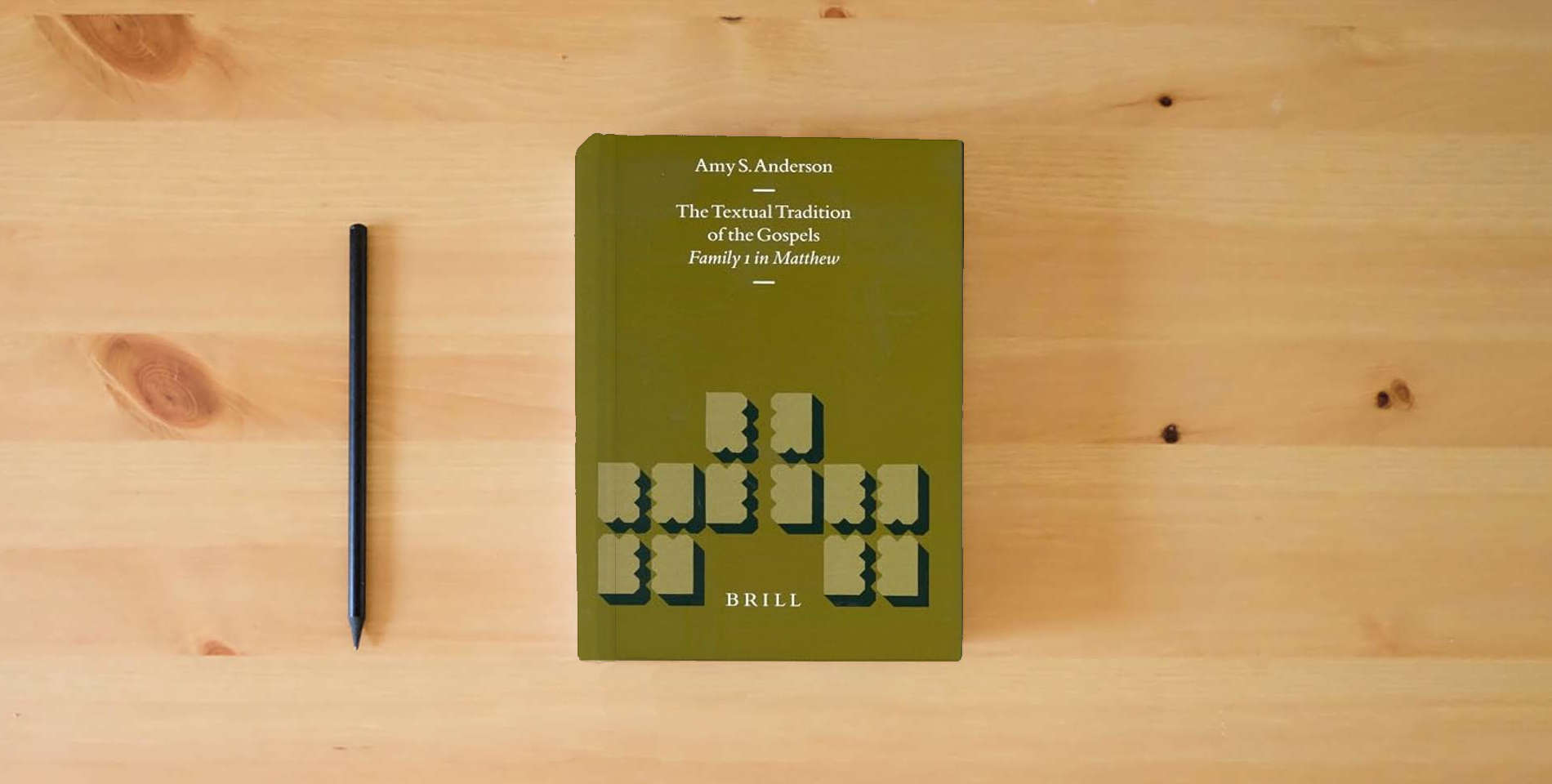 The book The Textual Tradition of the Gospels: Family 1 in Matthew (New Testament Tools, Studies and Documents, 32) is on the table