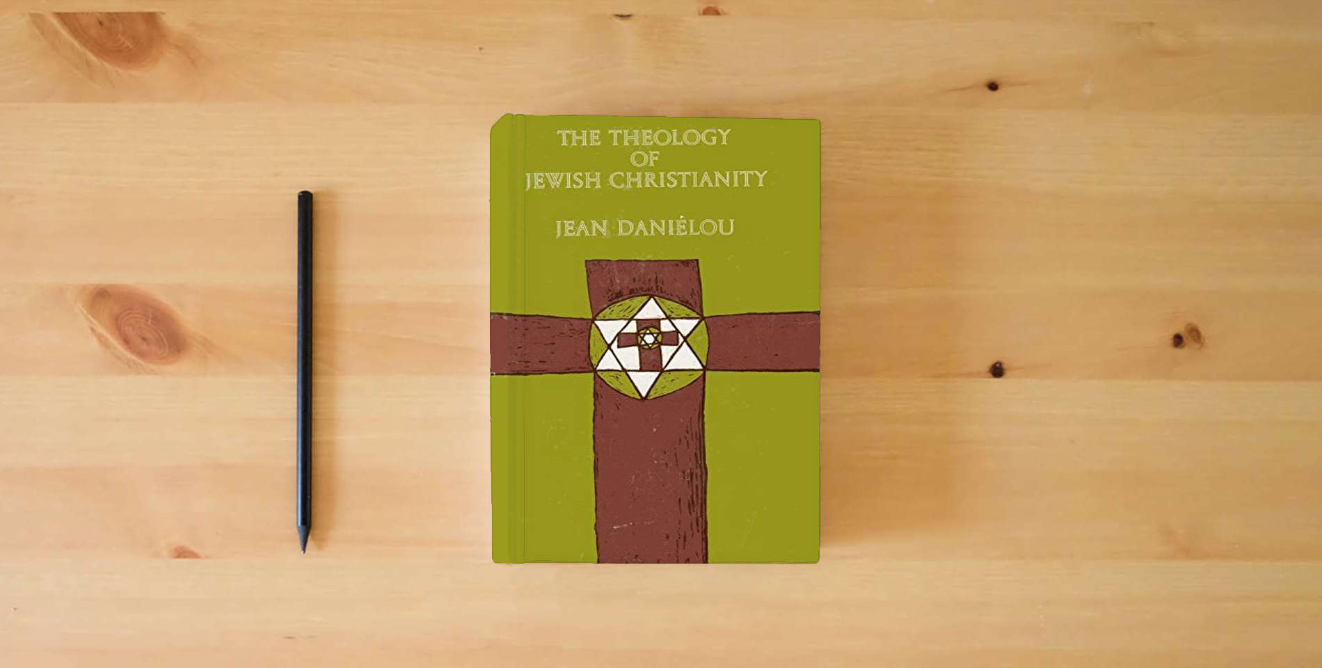 The book The Theology of Jewish Christianity [The Development of Christian Doctrine Before the Council of Nicaea, Volume 1] is on the table