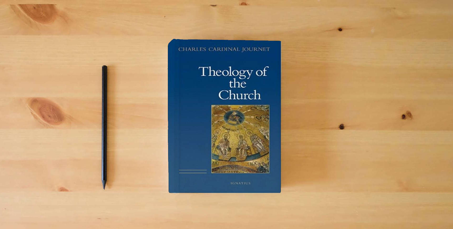 The book The Theology of the Church is on the table