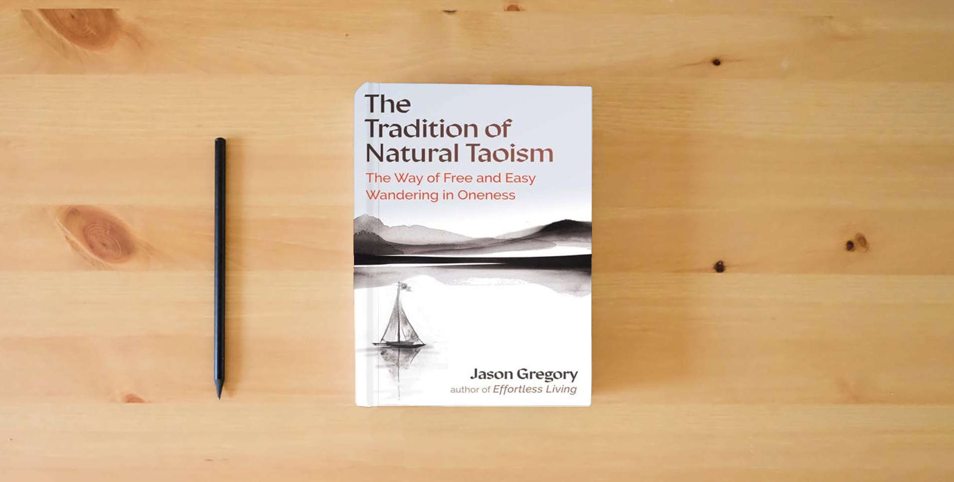 The book The Tradition of Natural Taoism: The Way of Free and Easy Wandering in Oneness is on the table