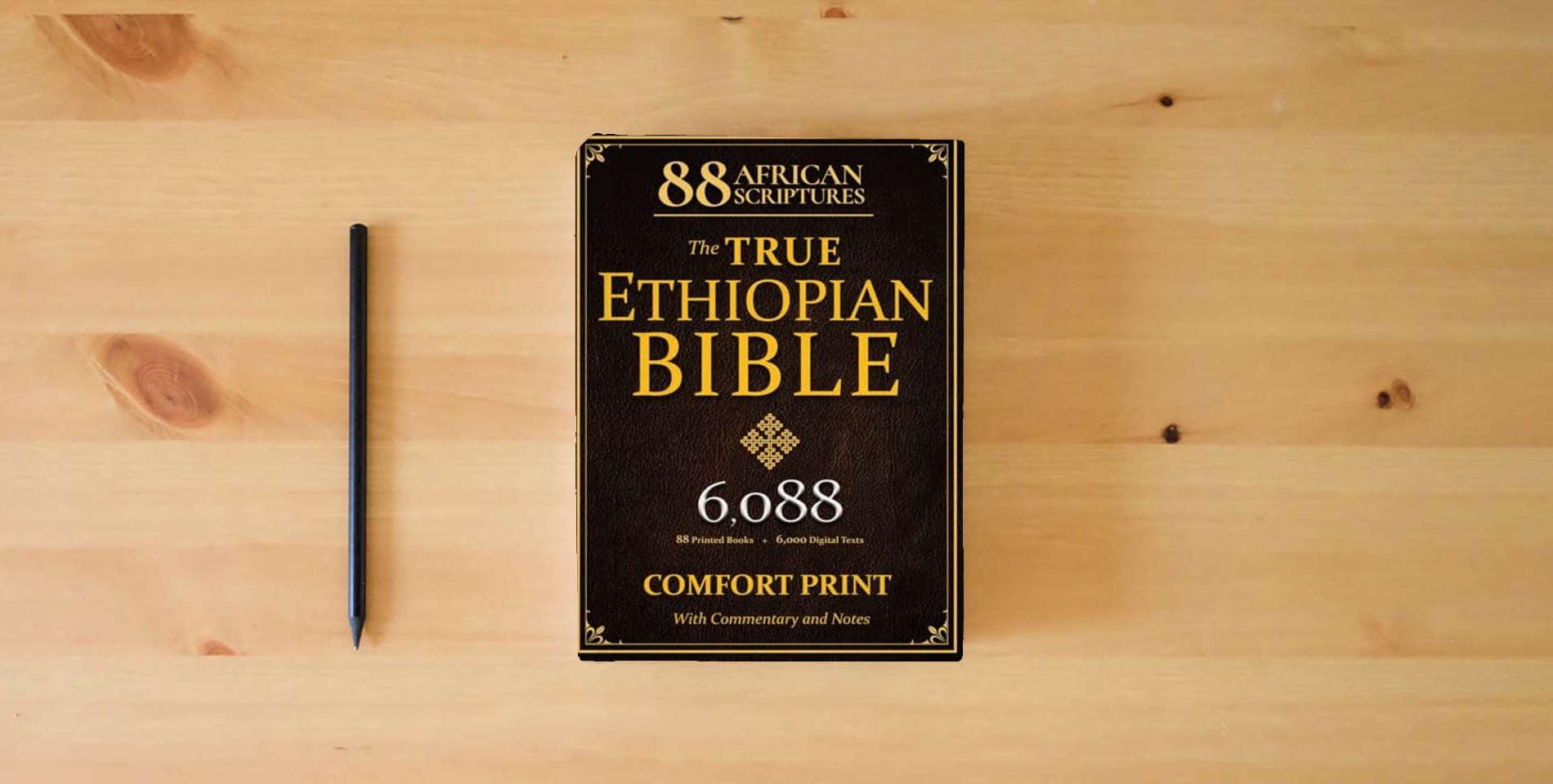The book THE TRUE ETHIOPIAN BIBLE COMPLETE in English |COMFORT PRINT|: All 88 African Scriptures Including the Book of Enoch, Jubilees, and Missing Apocrypha Once Lost to the Western World (Annotated) is on the table