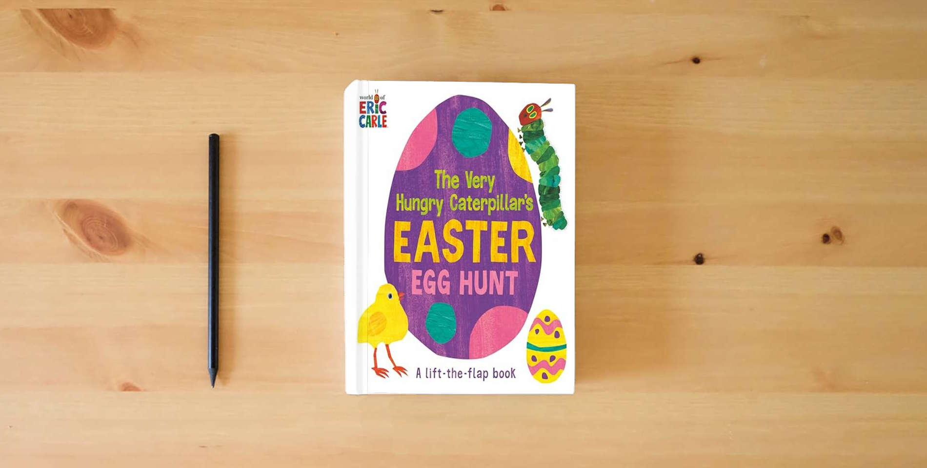 The book The Very Hungry Caterpillar's Easter Egg Hunt: A Lift-the-Flap-Book (World of Eric Carle) is on the table