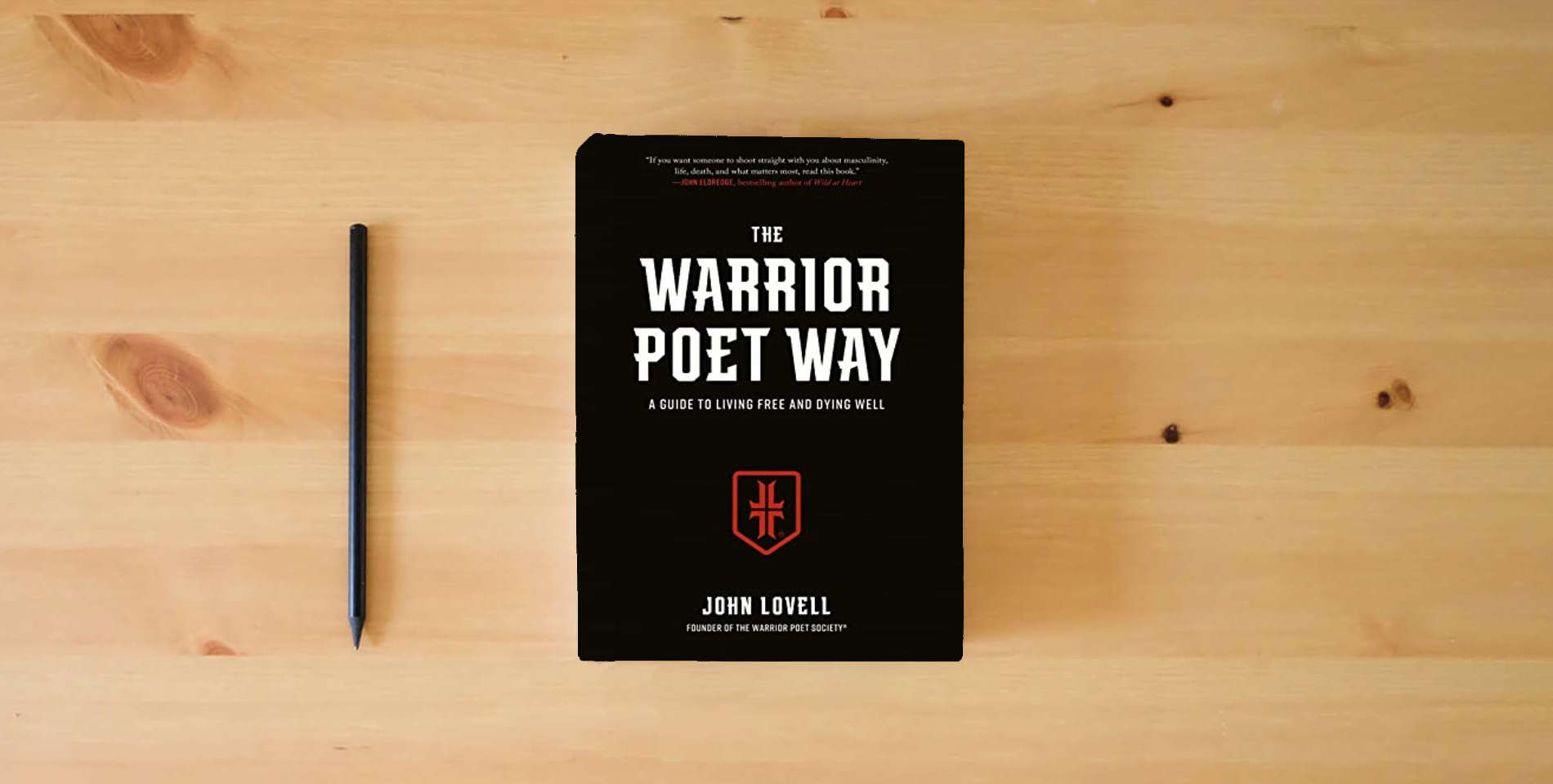 The book The Warrior Poet Way: A Guide to Living Free and Dying Well is on the table