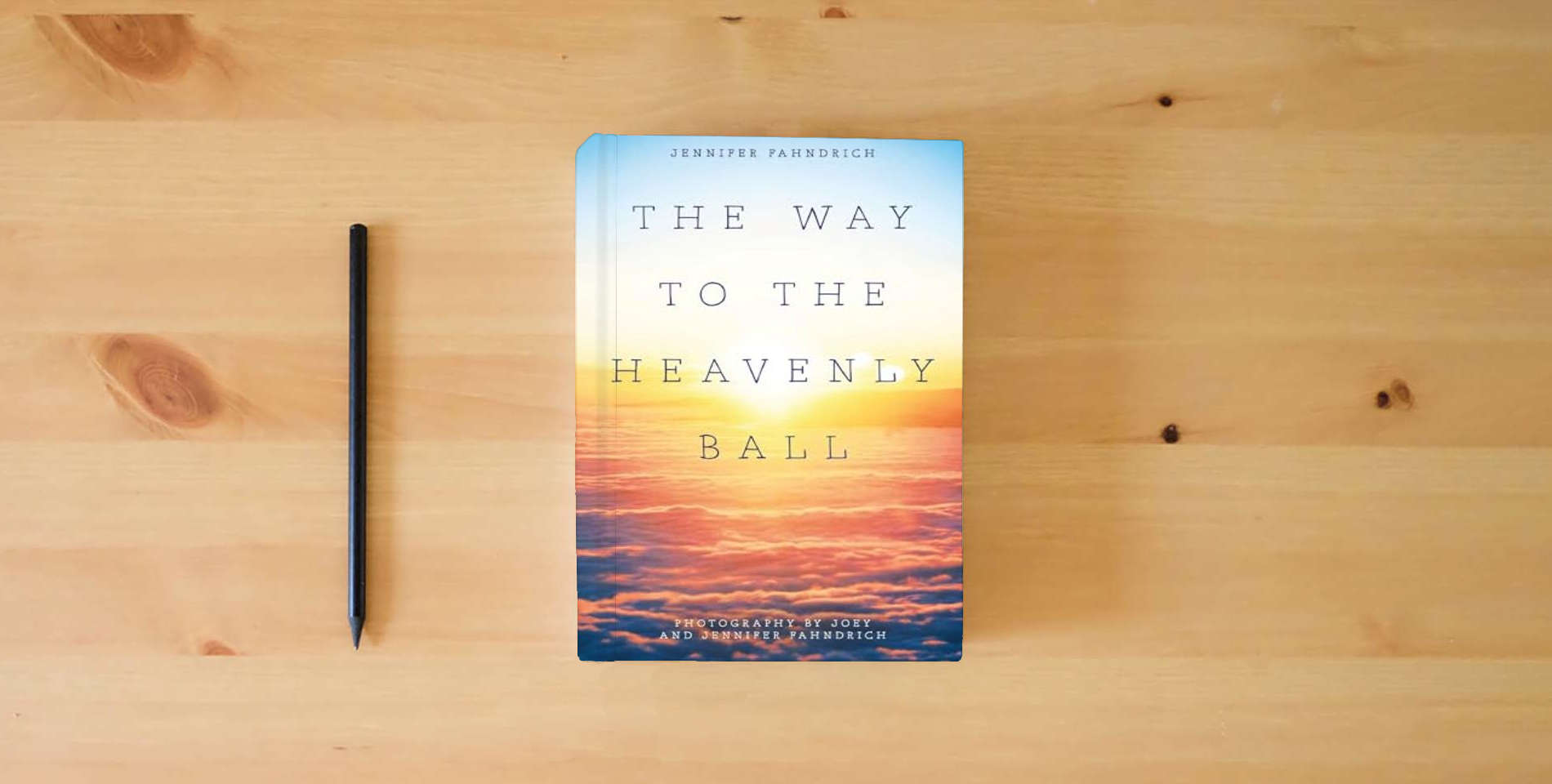 The book The Way to the Heavenly Ball is on the table