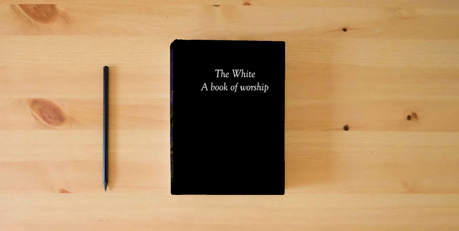 The book The White: A book of worship (special edition) is on the table