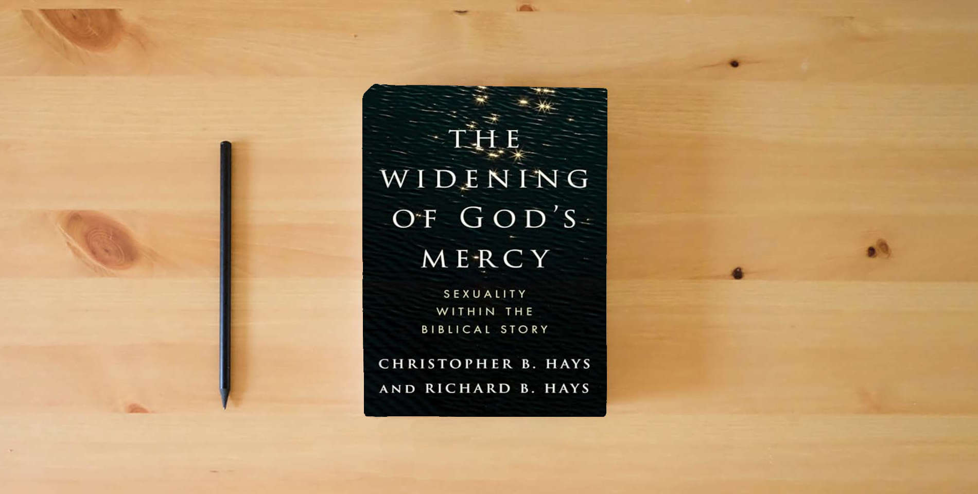 The book The Widening of God's Mercy: Sexuality Within the Biblical Story is on the table