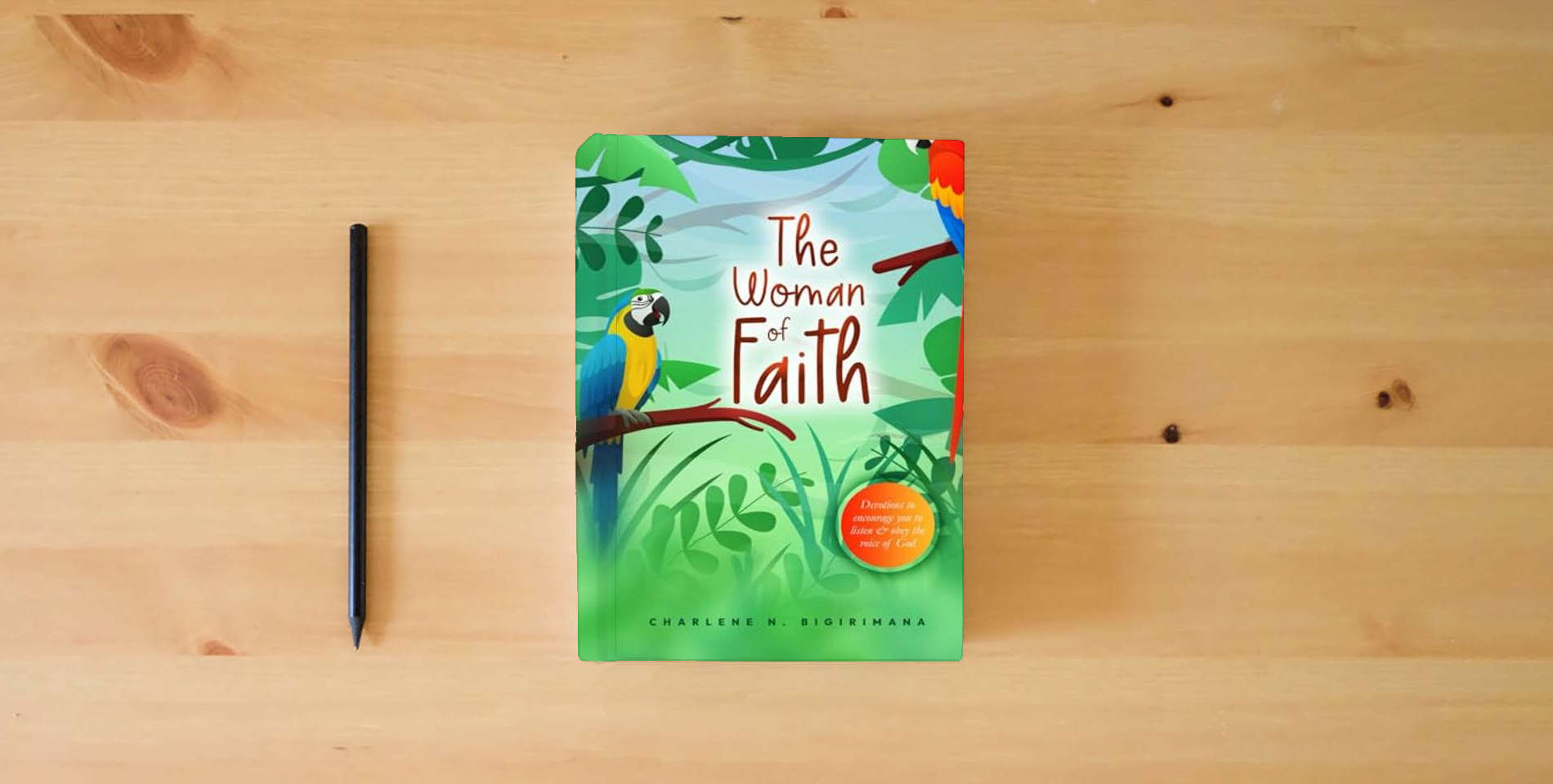 The book The Woman of Faith: Devotions to encourage you to listen & obey the voice of God is on the table