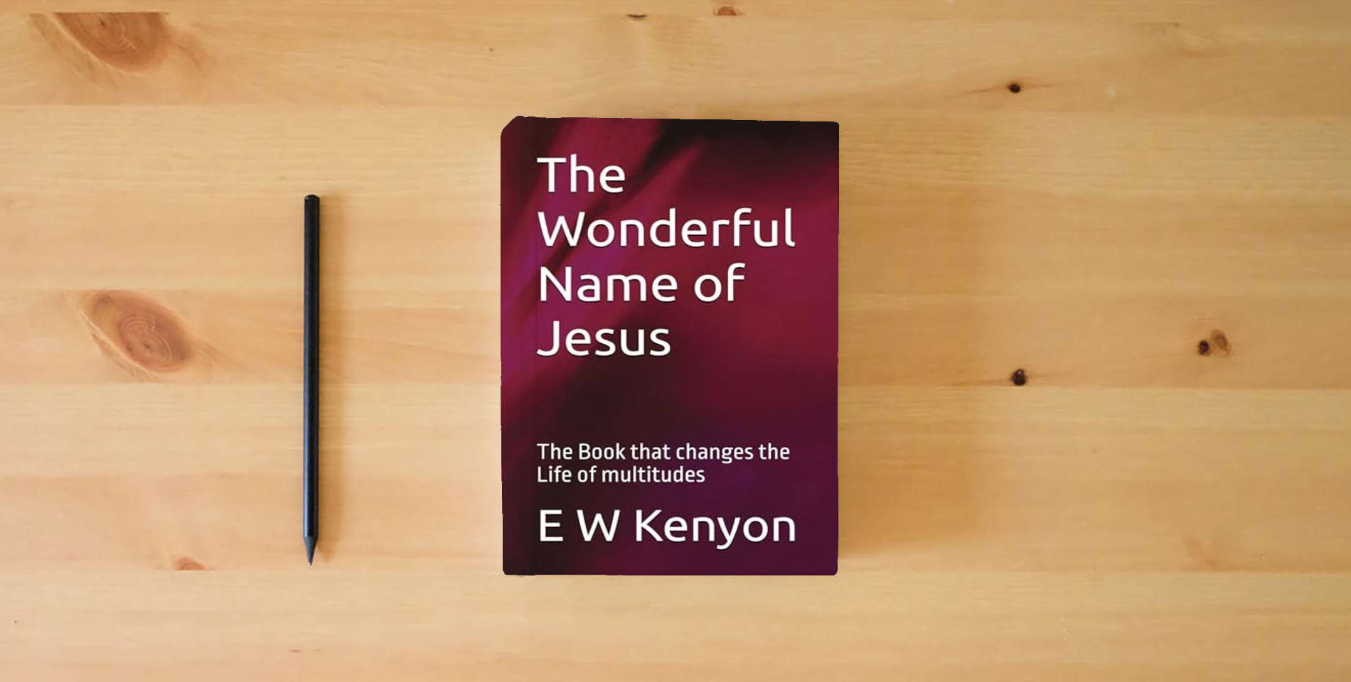 The book The Wonderful Name of Jesus: The Book that changes the Life of multitudes is on the table