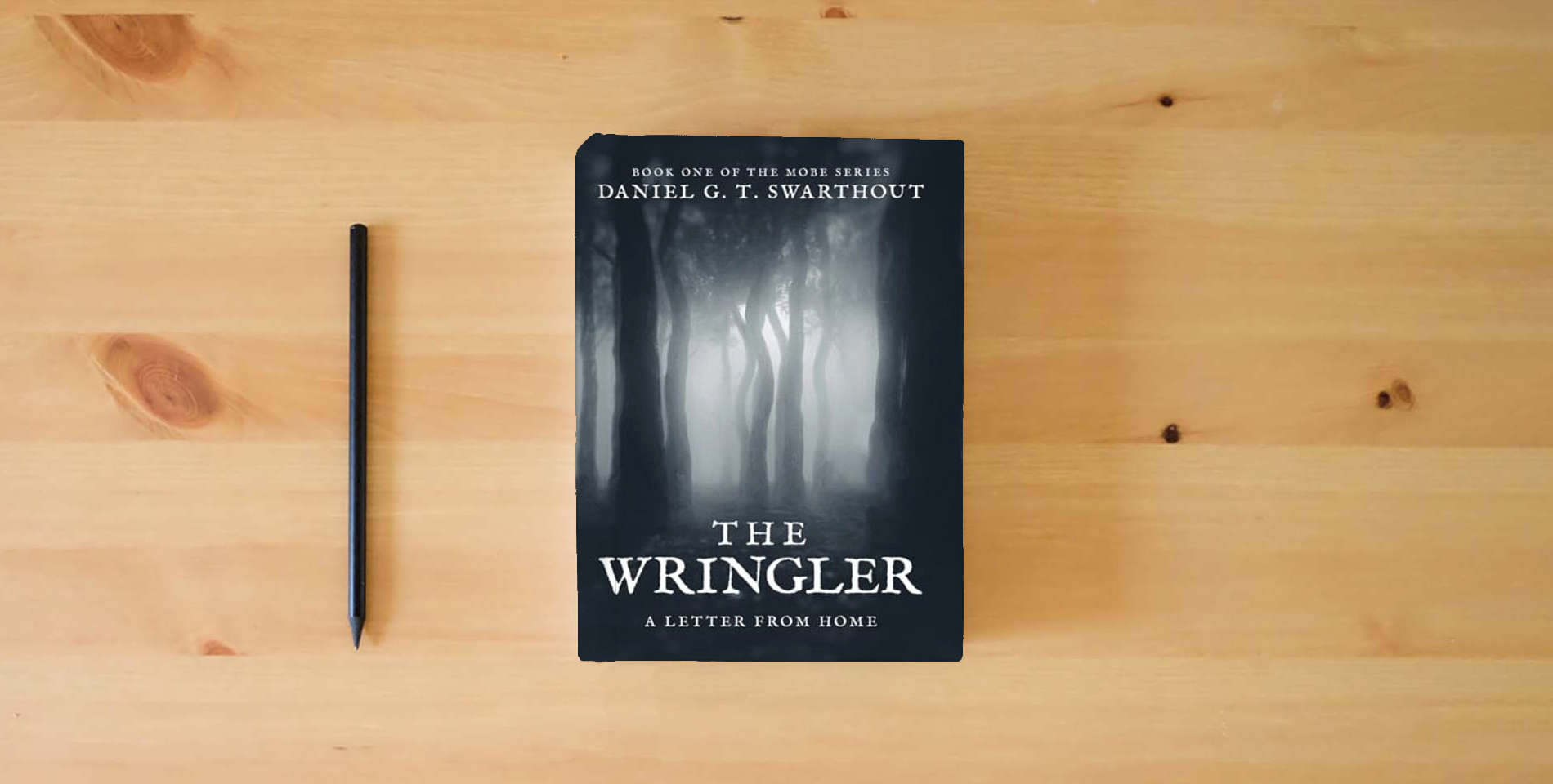 The book The Wringler: A Letter From Home: Book One of the MOBE Series is on the table